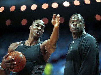 ORLANDO, FL - MAY 08:  Dwight Howard #12 of the Orlando Magic (L) chats with assistant coach Patrick Ewing prior to playing the Boston Celtics in Game three of the Eastern Conference Semifinals during the 2009 NBA Playoffs at at Amway Arena on May 8, 2009