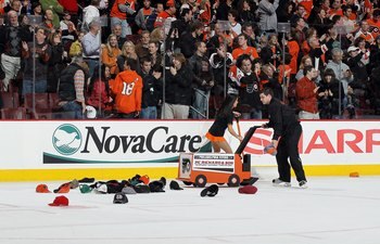 PHILADELPHIA, PA - MARCH 12:  Hats are removed from the ice after a hat trick by Ville Leino (not pictured)  of the Philadelphia Flyers against the Atlanta Thrashers on March 12, 2011 at Wells Fargo Center in Philadelphia, Pennsylvania. The Thrashers defe