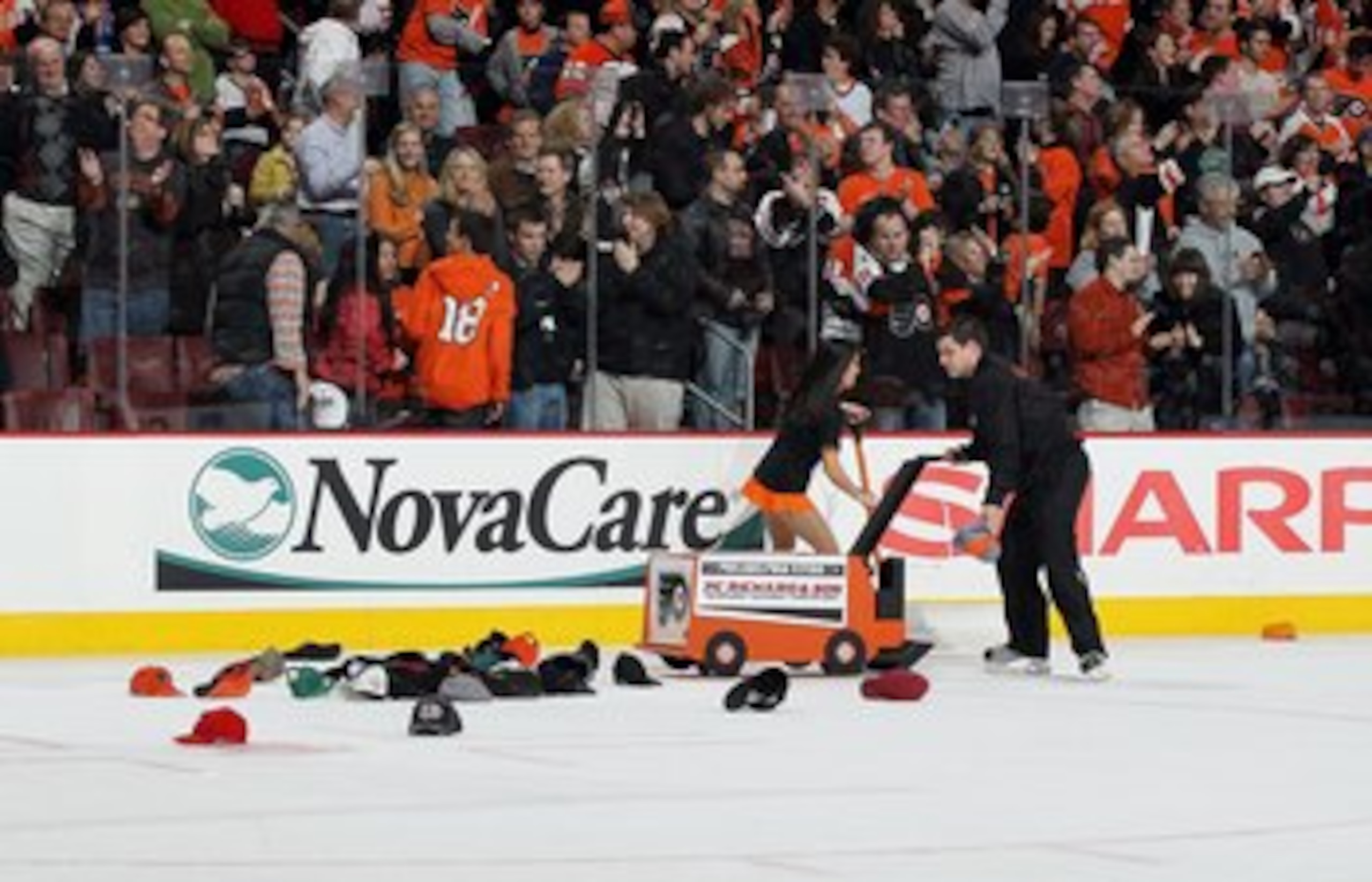 PHILADELPHIA, PA - MARCH 12: Hats are removed from the ice after a hat trick by Ville Leino (not pictured) of the Philadelphia Flyers against the Atlanta Thrashers on March 12, 2011 at Wells Fargo Center in Philadelphia, Pennsylvania. The Thrashers defe PHILADELPHIA, PA - MARCH 12: Hats are removed from the ice after a hat trick by Ville Leino (not pictured) of the Philadelphia Flyers against the Atlanta Thrashers on March 12, 2011 at Wells Fargo Center in Philadelphia, Pennsylvania. The Thrashers defe