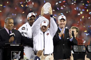 GLENDALE, AZ - JANUARY 10:  Head coach Gene Chizik of the Auburn Tigers celebrates the Tigers 22-19 victory against the Oregon Ducks during the Tostitos BCS National Championship Game at University of Phoenix Stadium on January 10, 2011 in Glendale, Arizo