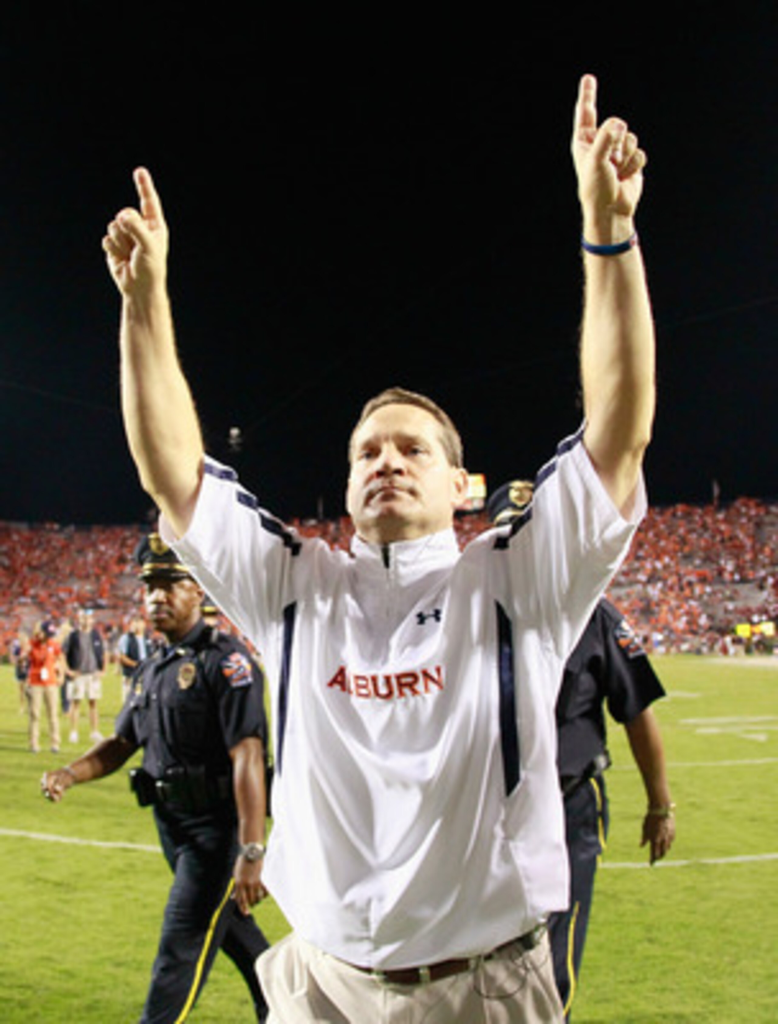 AUBURN, AL - SEPTEMBER 25:  Head coach Gene Chizik of the Auburn Tigers celebrates after their 35-27 win over the South Carolina Gamecocks at Jordan-Hare Stadium on September 25, 2010 in Auburn, Alabama.  (Photo by Kevin C. Cox/Getty Images)