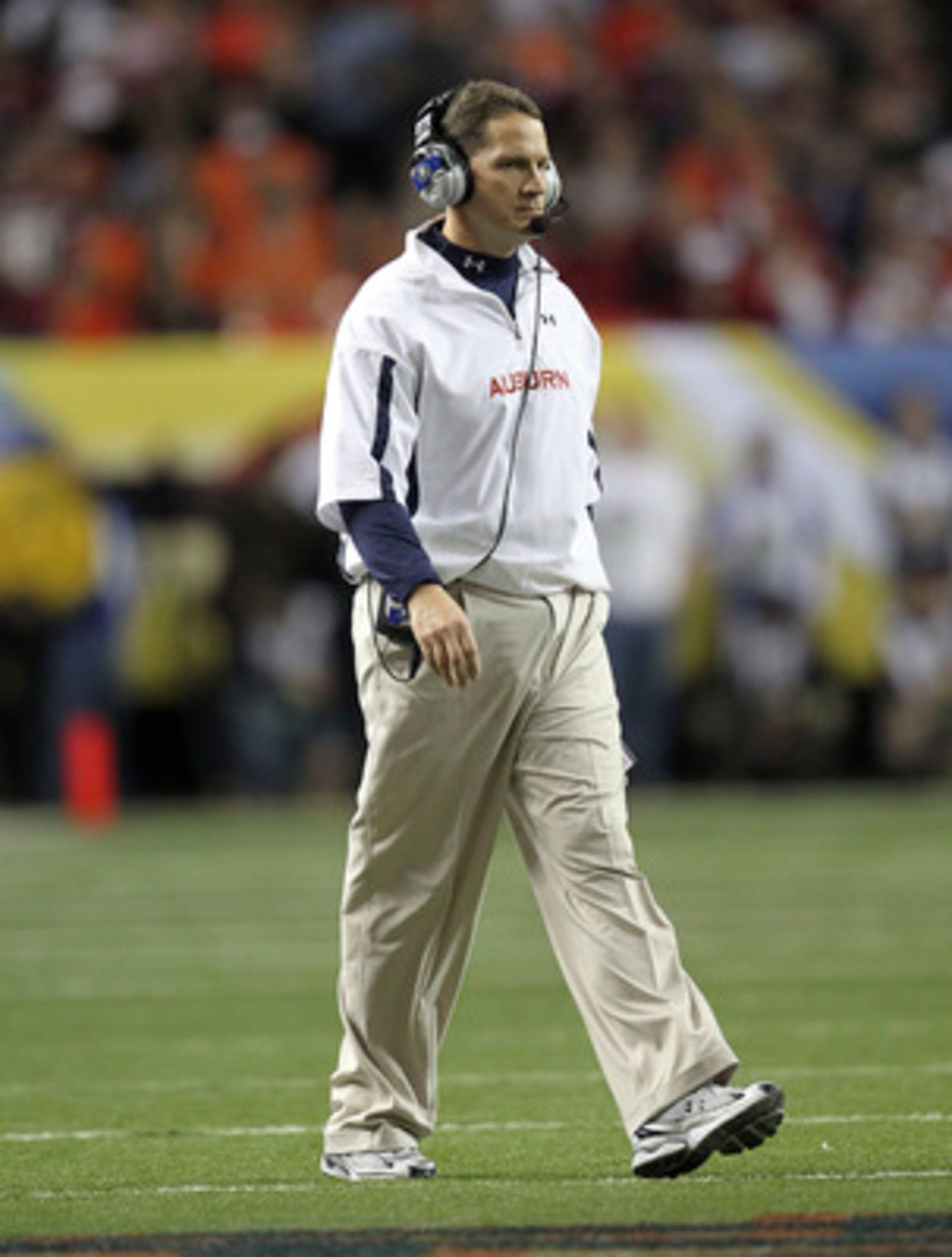 ATLANTA - DECEMBER 4:  Head coach Gene Chizik of the Auburn Tigers walks on the field during a timeout during the 2010 SEC Championship against the South Carolina Gamecocks at Georgia Dome on December 4, 2010 in Atlanta, Georgia. (Photo by Mike Zarrilli/G