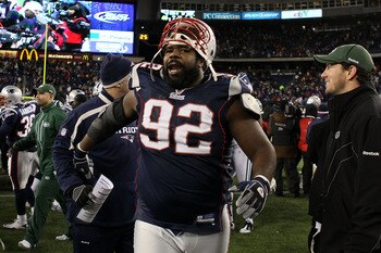 FOXBORO, MA - DECEMBER 06:  Gerard Warren #92 of the New England Patriots celebrates as he walks off the field after the Patriots won 45-3 against the New York Jets at Gillette Stadium on December 6, 2010 in Foxboro, Massachusetts.  (Photo by Elsa/Getty I