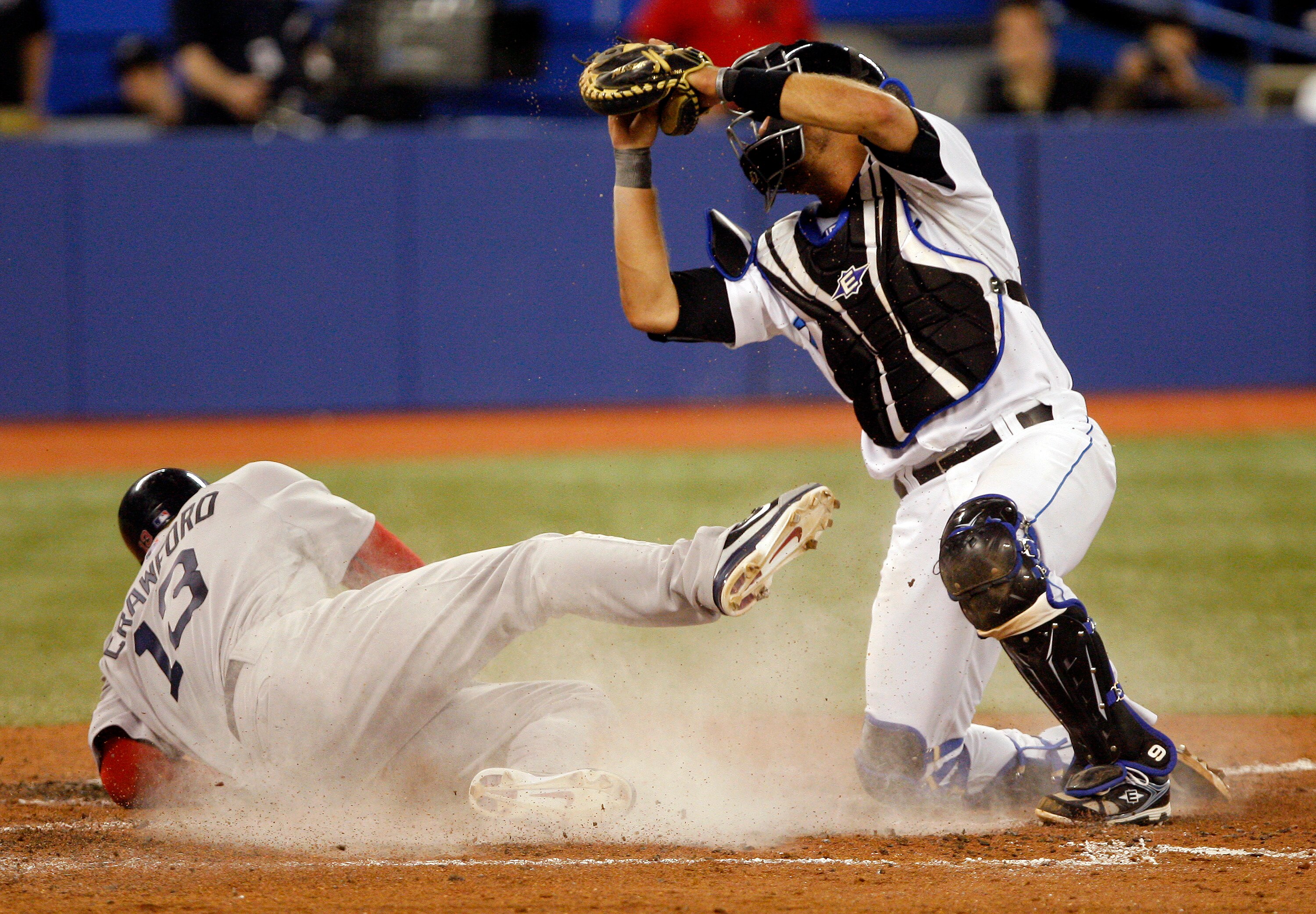 TORONTO, CANADA - MAY 10: J.P. Arencibia #9 of the Toronto Blue Jays stops Carl Crawford #13 of the Boston Red Sox at home during MLB action at the Rogers Centre May 10, 2011 in Toronto, Ontario, Canada. (Photo by Abelimages/Getty Images)