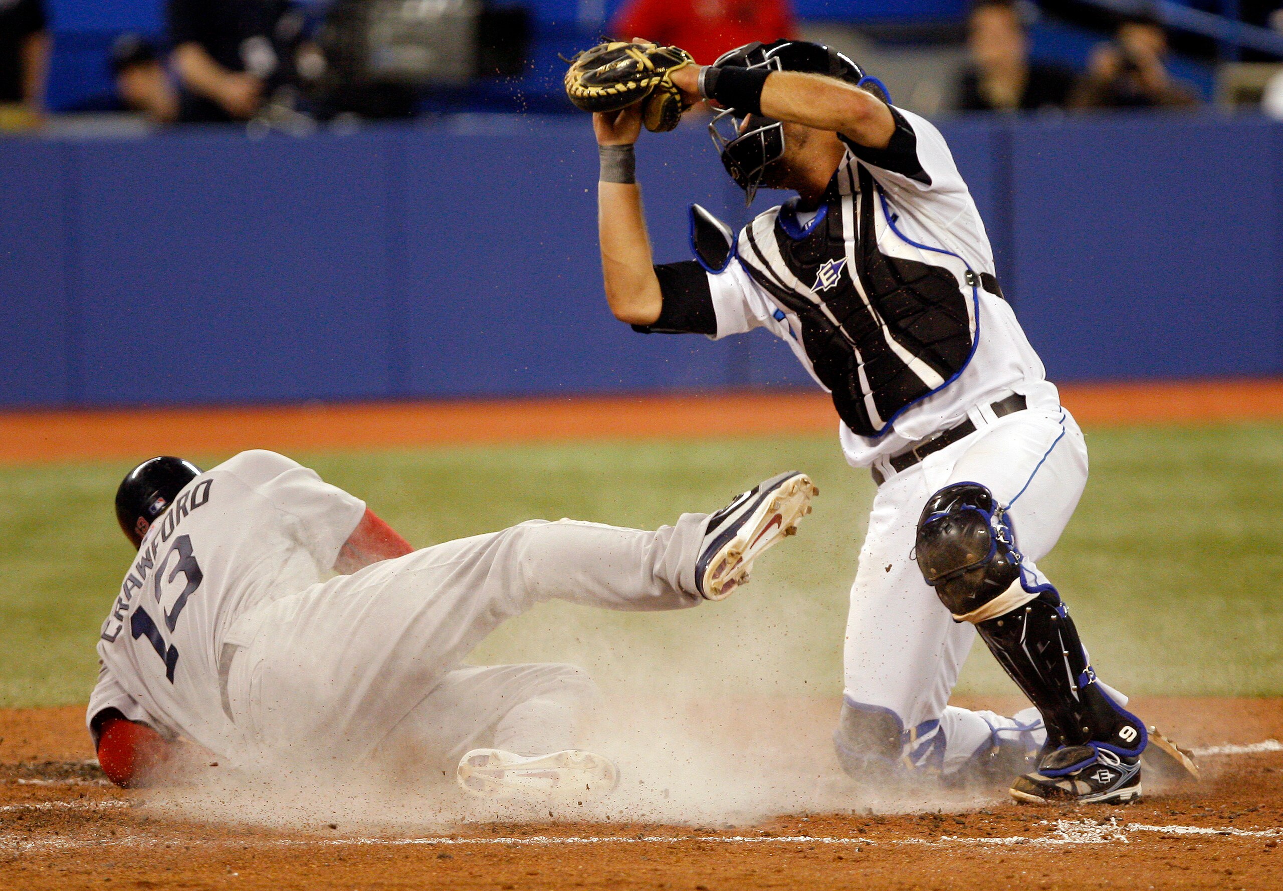 TORONTO, CANADA - MAY 10: J.P. Arencibia #9 of the Toronto Blue Jays stops Carl Crawford #13 of the Boston Red Sox at home during MLB action at the Rogers Centre May 10, 2011 in Toronto, Ontario, Canada. (Photo by Abelimages/Getty Images)