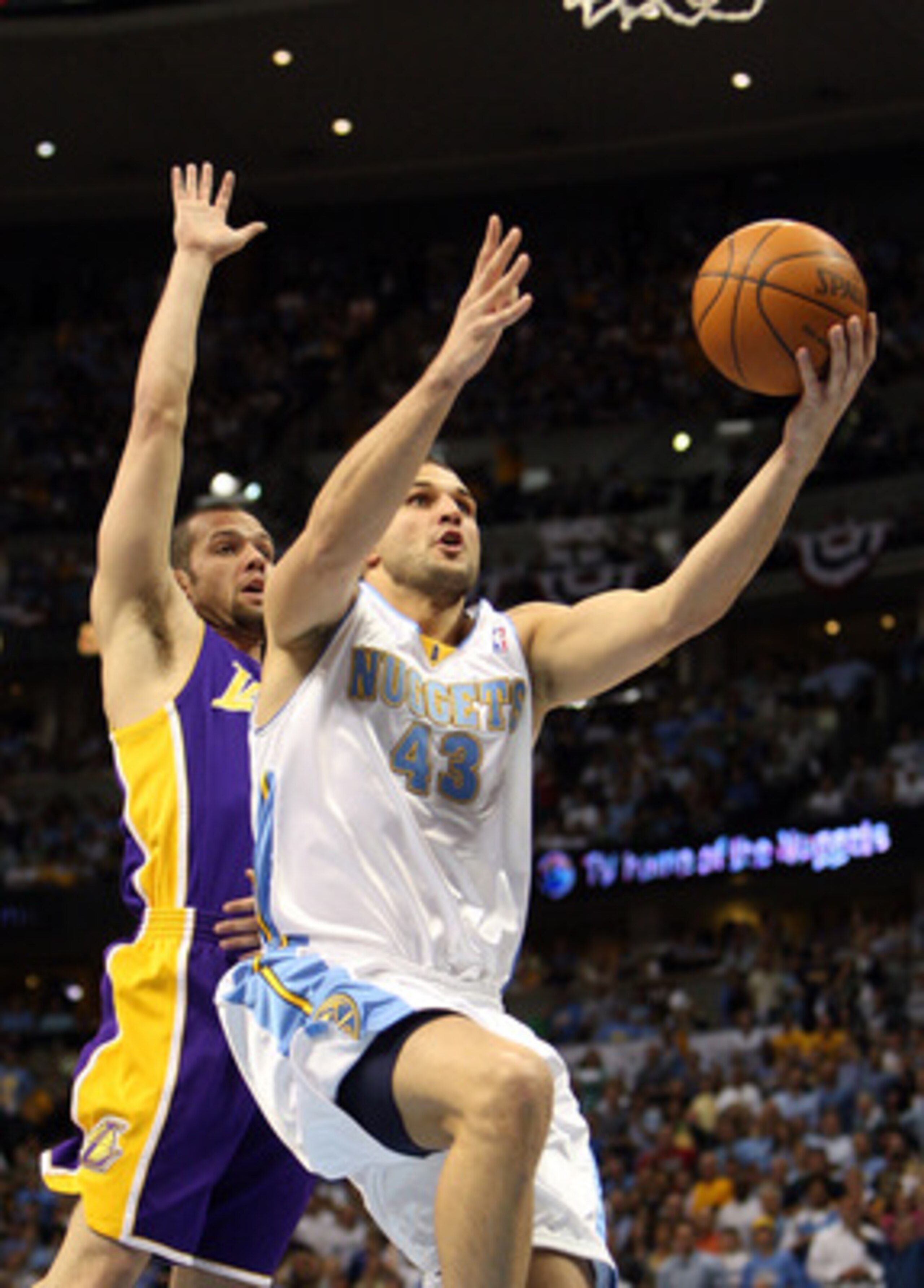 DENVER - MAY 29: Linas Kleiza #43 of the Denver Nuggets goes up for a shot in front of Jordan Farmar #5 of the Los Angeles Lakers in Game Six of the Western Conference Finals during the 2009 NBA Playoffs at Pepsi Center on May 29, 2009 in Denver, Colorad DENVER - MAY 29: Linas Kleiza #43 of the Denver Nuggets goes up for a shot in front of Jordan Farmar #5 of the Los Angeles Lakers in Game Six of the Western Conference Finals during the 2009 NBA Playoffs at Pepsi Center on May 29, 2009 in Denver, Colorad