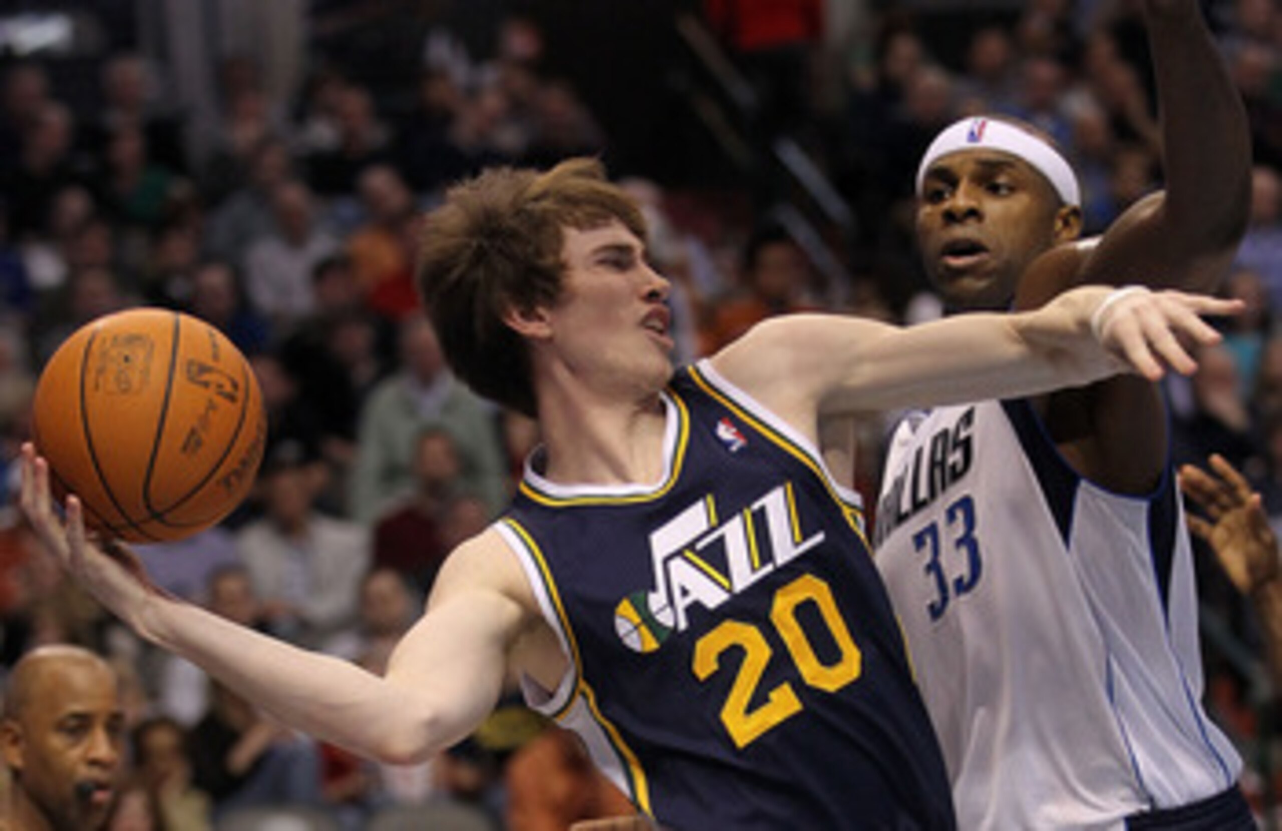 DALLAS, TX - FEBRUARY 23: Forward Gordon Hayward #20 of the Utah Jazz passes the ball against Brendan Haywood #33 of the Dallas Mavericks at American Airlines Center on February 23, 2011 in Dallas, Texas. NOTE TO USER: User expressly acknowledges and ag DALLAS, TX - FEBRUARY 23: Forward Gordon Hayward #20 of the Utah Jazz passes the ball against Brendan Haywood #33 of the Dallas Mavericks at American Airlines Center on February 23, 2011 in Dallas, Texas. NOTE TO USER: User expressly acknowledges and ag