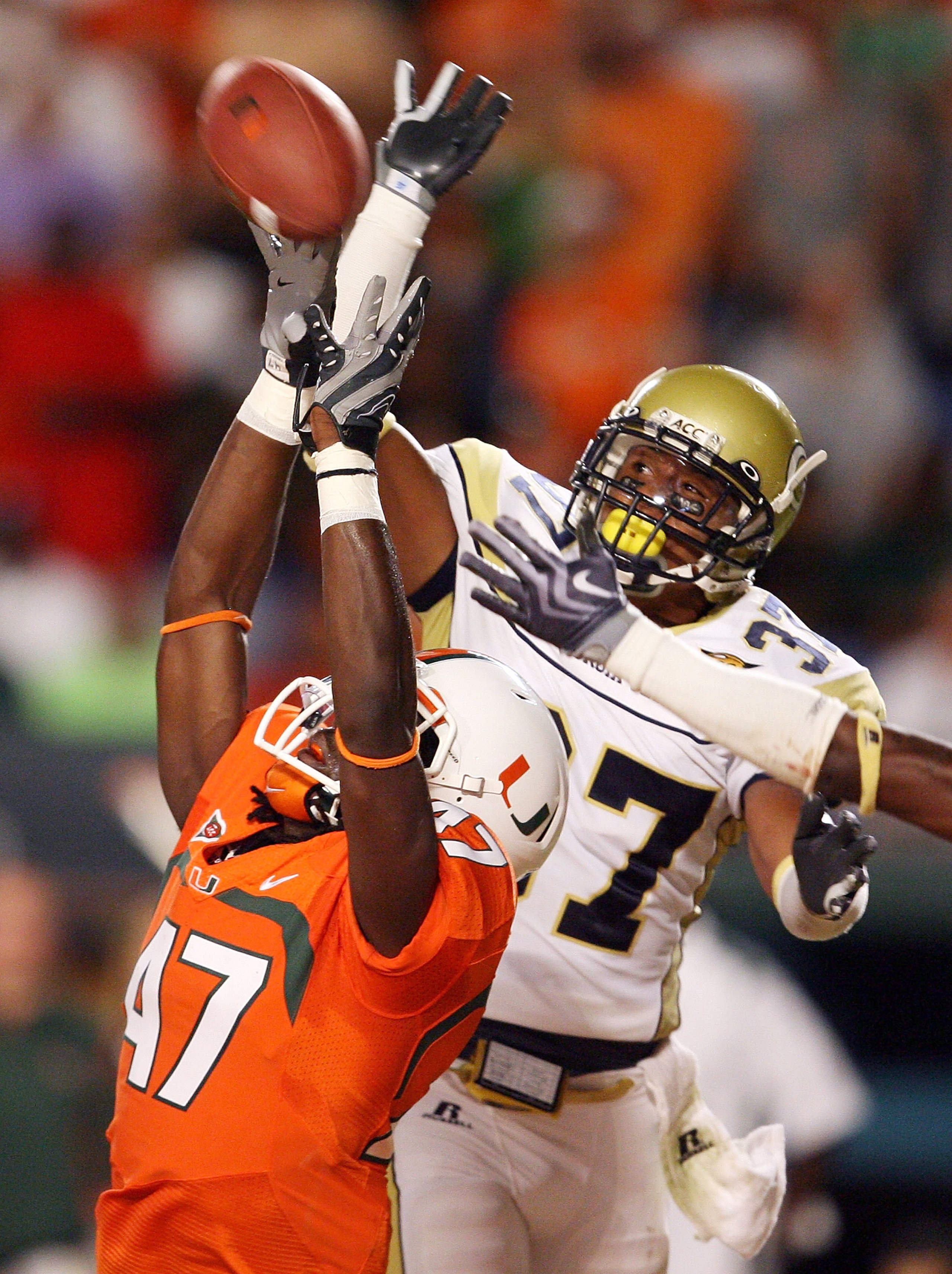 FORT LAUDERDALE, FL - SEPTEMBER 17:  Cornerback Jerrard Tarrant #37 Georgia Tech Yellow Jackets breaks up a pass intended for wide receiver LaRon Byrd #47 of the Miami Hurricanes at Land Shark Stadium on September 17, 2009 in Fort Lauderdale, Florida.  (P