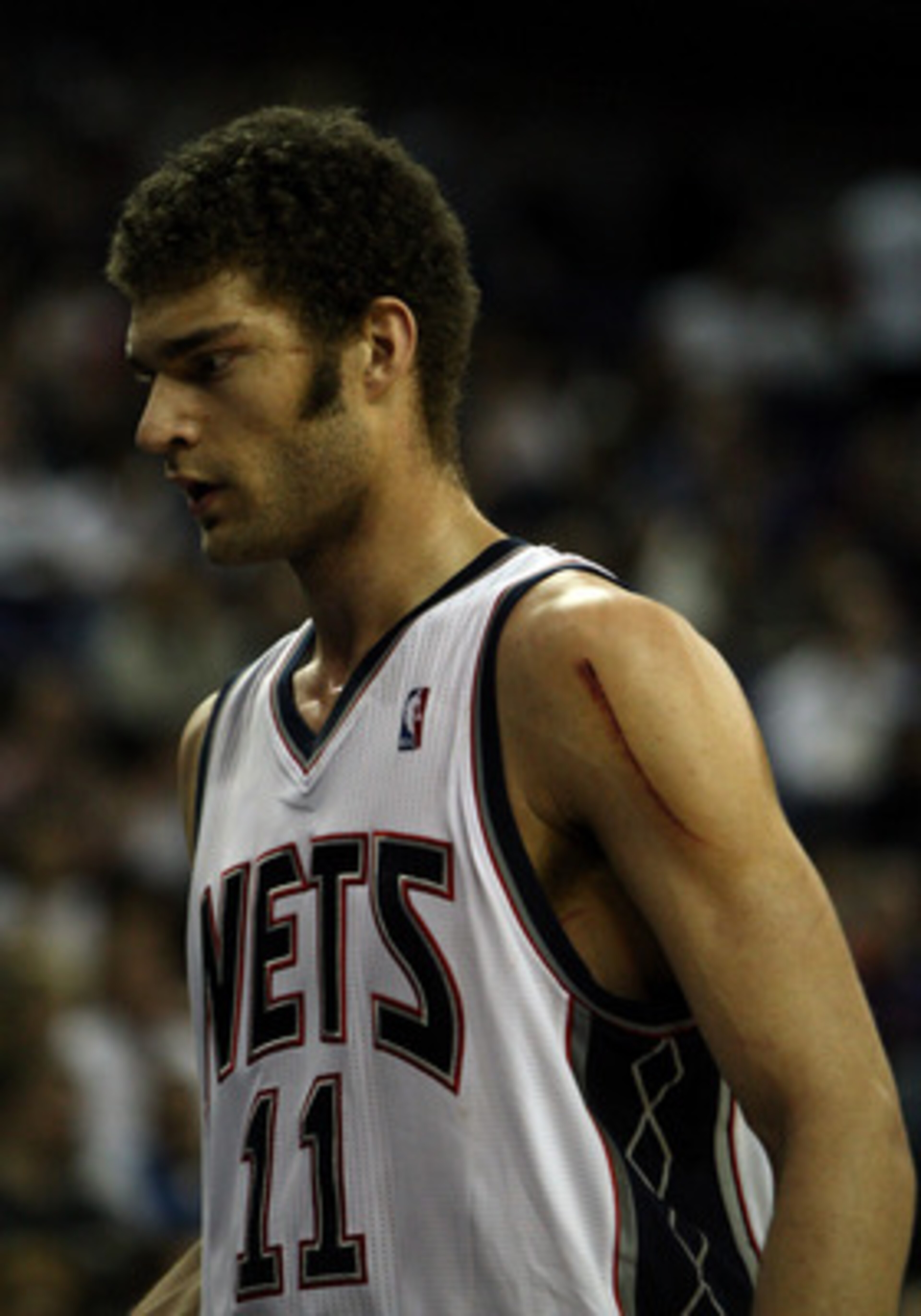 LONDON, ENGLAND - MARCH 04: Nets Captain, Brook Lopez #11 leaves the court during the NBA match between New Jersey Nets and the Toronto Raptors at the O2 Arena on March 4, 2011 in London, England. NOTE TO USER: User expressly acknowledges and agrees that LONDON, ENGLAND - MARCH 04: Nets Captain, Brook Lopez #11 leaves the court during the NBA match between New Jersey Nets and the Toronto Raptors at the O2 Arena on March 4, 2011 in London, England. NOTE TO USER: User expressly acknowledges and agrees that