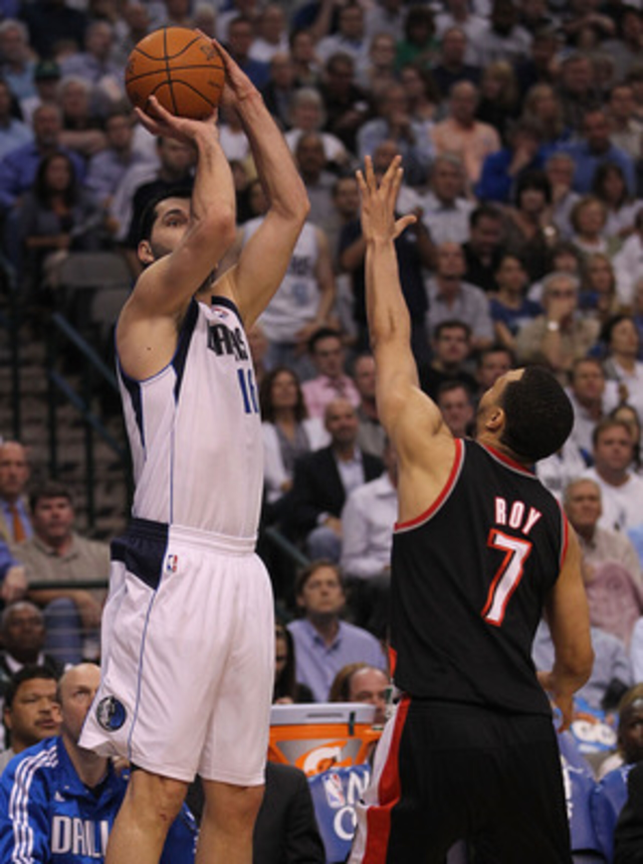 DALLAS, TX - APRIL 25:  Forward Peja Stojakovic #16 of the Dallas Mavericks takes a shot against Brandon Roy #7 of the Portland Trail Blazers in Game Five of the Western Conference Quarterfinals during the 2011 NBA Playoffs on April 25, 2011 at American A