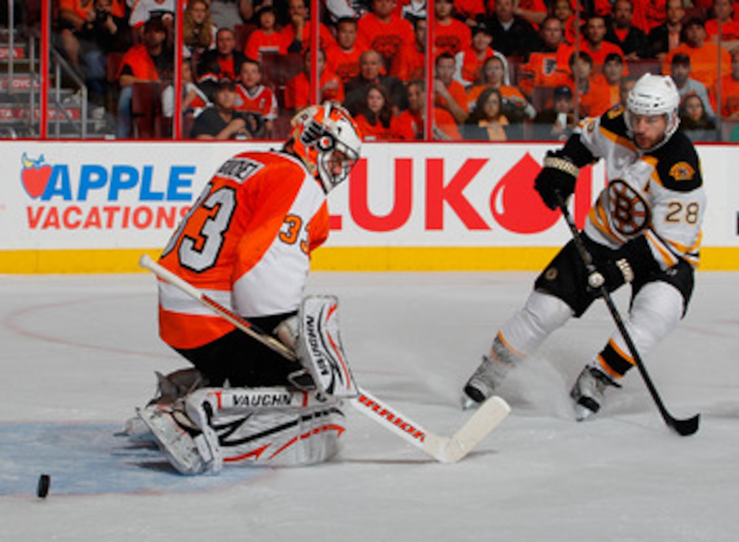 PHILADELPHIA, PA - MAY 02:  Mark Recchi #28 of the Boston Bruins shoots the puck as goalie Brian Boucher #33 of the Philadelphia Flyers makes the save in Game Two of the Eastern Conference Semifinals during the 2011 NHL Stanley Cup Playoffs at Wells Fargo