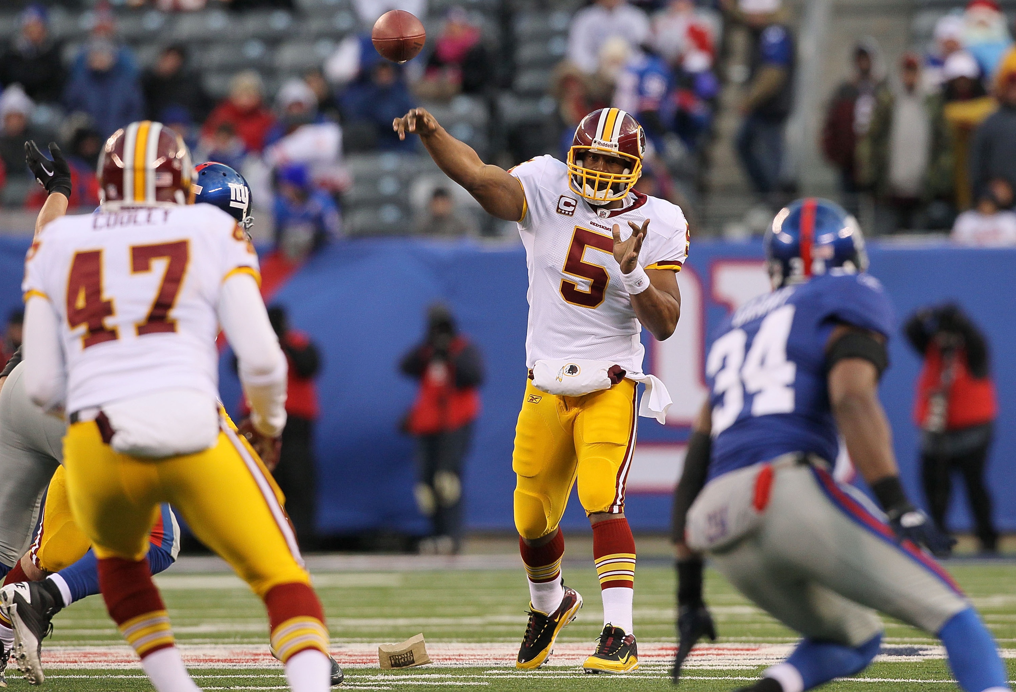 EAST RUTHERFORD, NJ - DECEMBER 05:  Donovan McNabb #5 of the Washington Redskins throws a pass against the New York Giants on December 5, 2010 at the New Meadowlands Stadium in East Rutherford, New Jersey. The Giants defeated the Redskins 31-7.  (Photo by