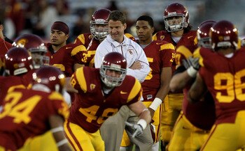 LOS ANGELES - NOVEMBER 27:  Head coach Lane Kiffin of the USC Trojans watches warmups for the game with the Notre Dame Fighting Irish at the Los Angeles Memorial Coliseum on November 27, 2010 in Los Angeles, California.   (Photo by Stephen Dunn/Getty Imag