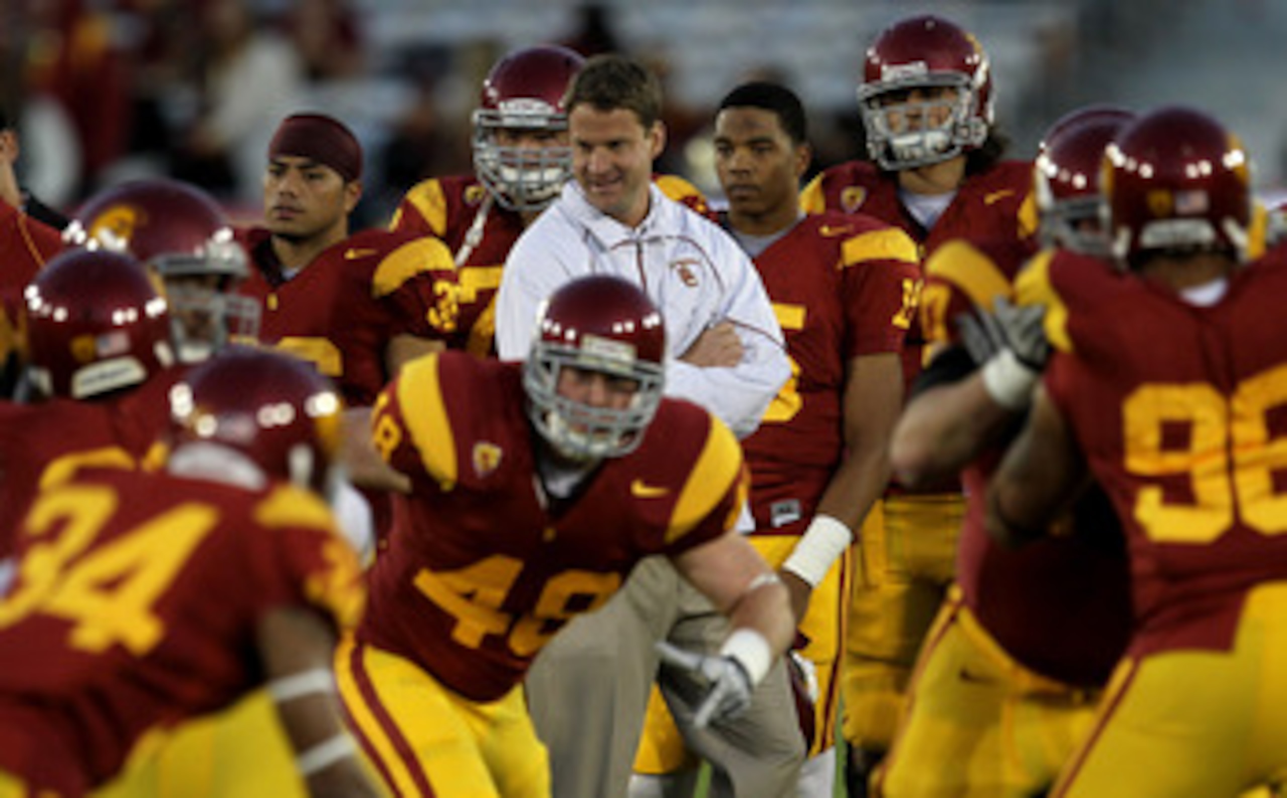 LOS ANGELES - NOVEMBER 27:  Head coach Lane Kiffin of the USC Trojans watches warmups for the game with the Notre Dame Fighting Irish at the Los Angeles Memorial Coliseum on November 27, 2010 in Los Angeles, California.   (Photo by Stephen Dunn/Getty Imag