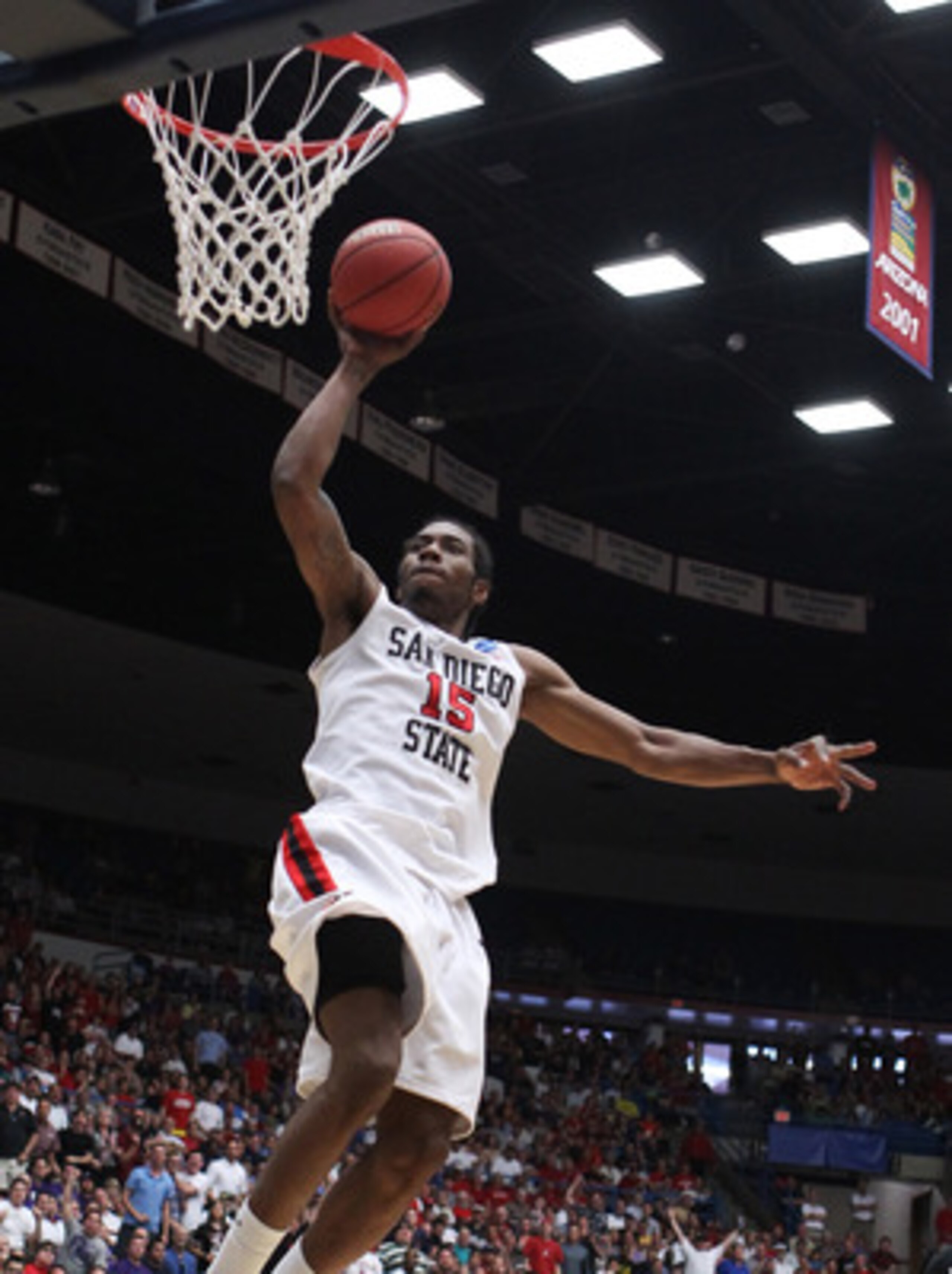 TUCSON, AZ - MARCH 19:  Kawhi Leonard #15 of the San Diego State Aztecs shoots past Scootie Randall #33 of the Temple Owls during the third round of the 2011 NCAA men's basketball tournament at McKale Center on March 19, 2011 in Tucson, Arizona.  (Photo b