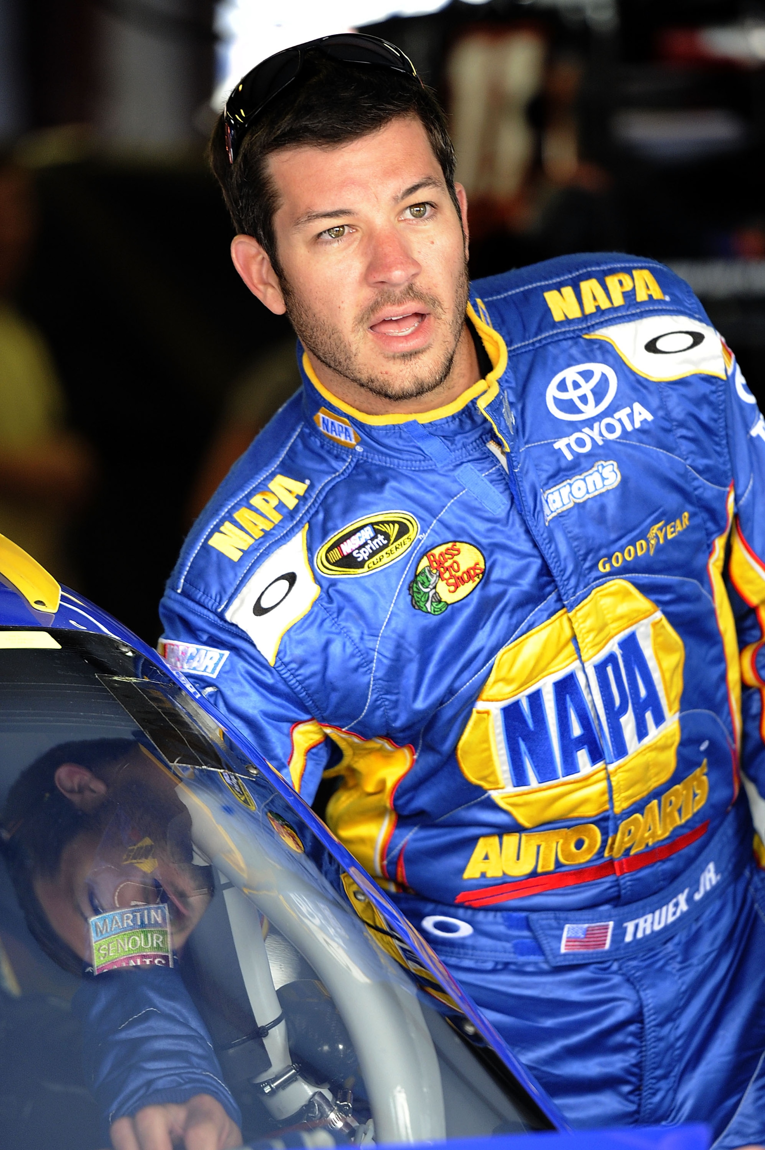 TALLADEGA, AL - APRIL 15: Martin Truex Jr., driver of the #56 NAPA Auto Parts Toyota, stands in the garage during practice for the NASCAR Sprint Cup Series Aaron's 499 at Talladega Superspeedway on April 15, 2011 in Talladega, Alabama. (Photo by John Ha TALLADEGA, AL - APRIL 15: Martin Truex Jr., driver of the #56 NAPA Auto Parts Toyota, stands in the garage during practice for the NASCAR Sprint Cup Series Aaron's 499 at Talladega Superspeedway on April 15, 2011 in Talladega, Alabama. (Photo by John Ha