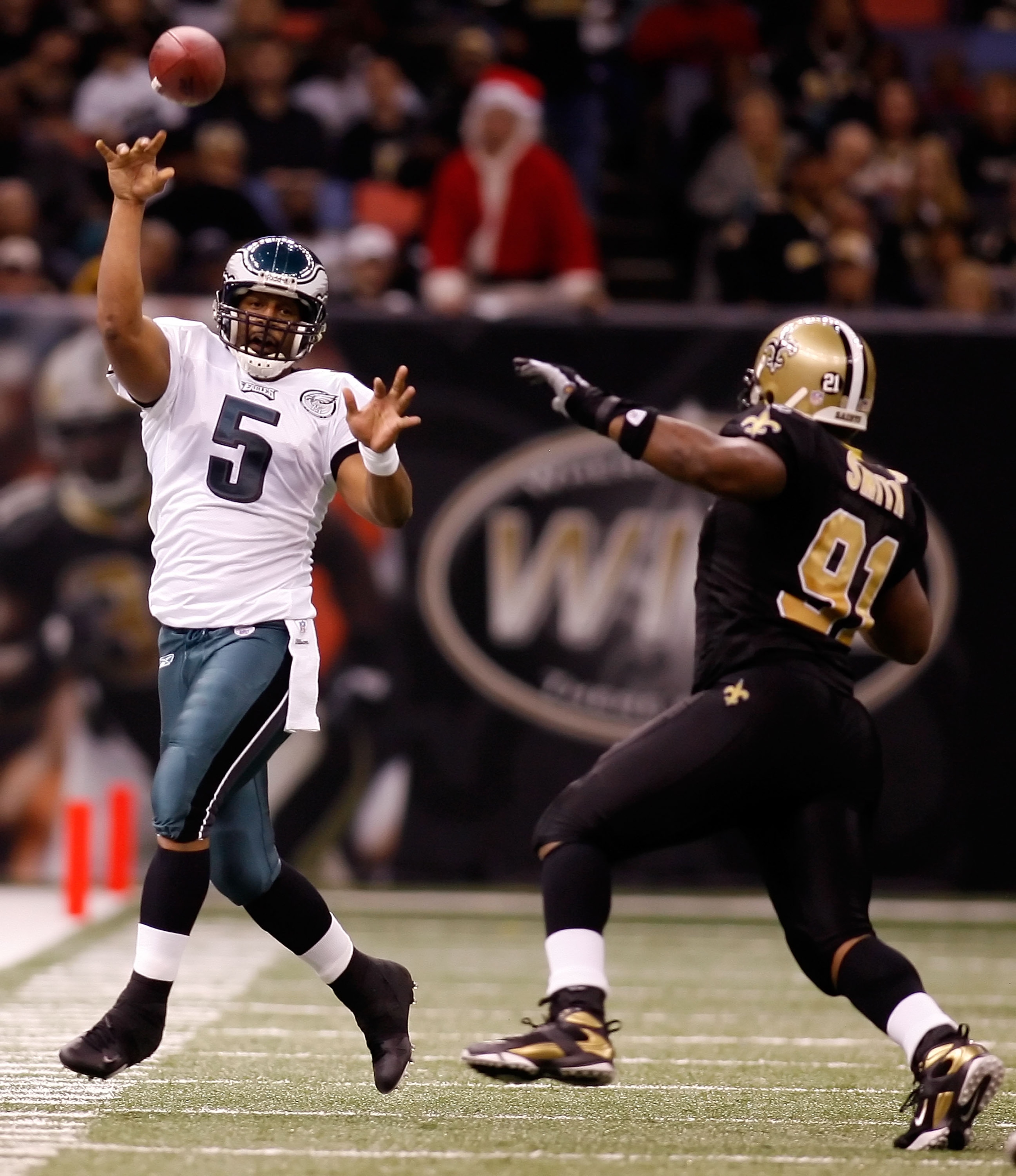 NEW ORLEANS - DECEMBER 23:  Donovan McNabb #5 of the Philadelphia Eagles throws a pass over Will Smnith #91 of the New Orleans Saints on December 23, 2007 at the Louisiana Superdome in New Orleans, Louisiana.  (Photo by Chris Graythen/Getty Images)