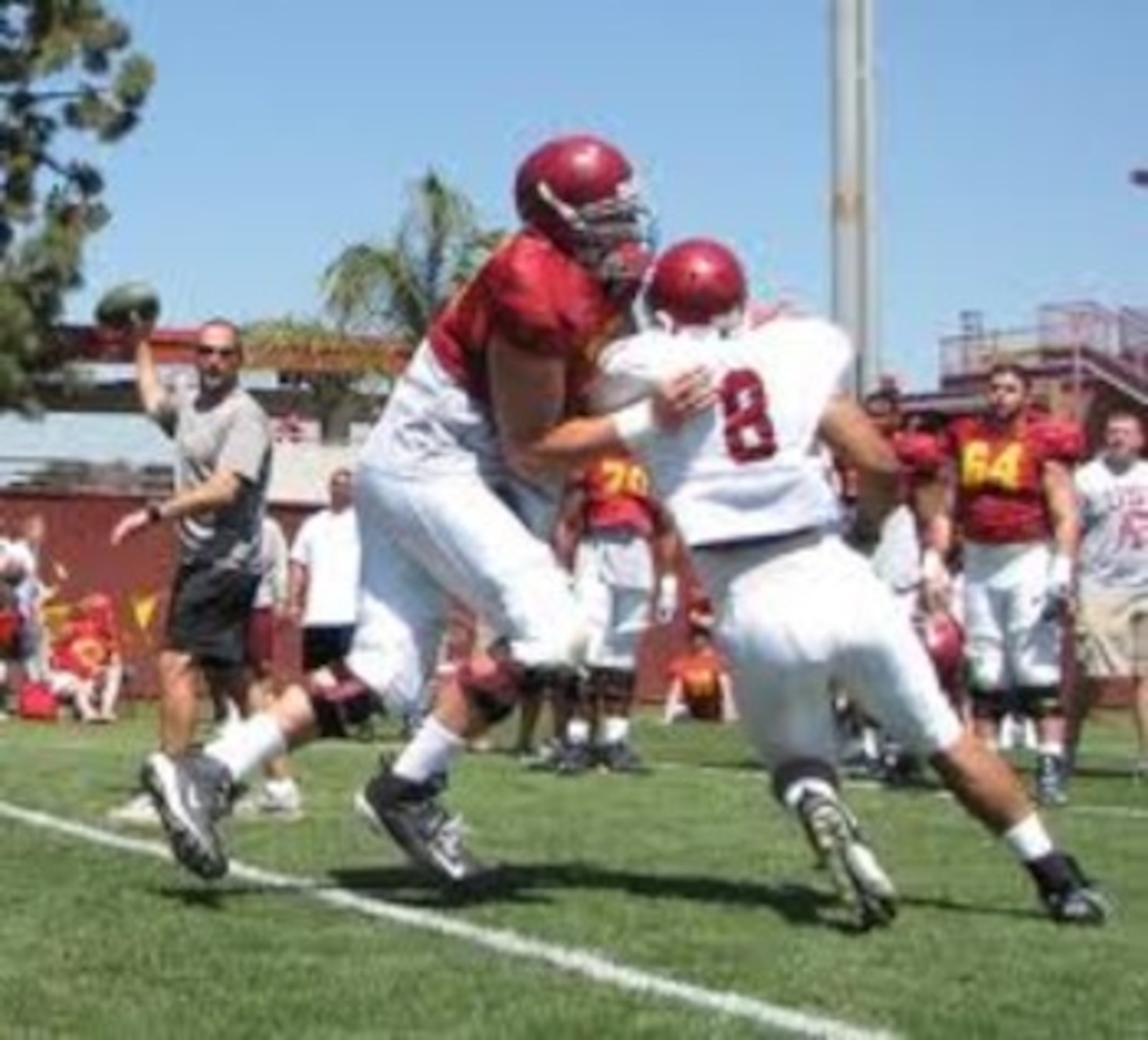OT Matt Kalil may leave early for the NFL; here he is blocking DE Nick Perry in practice