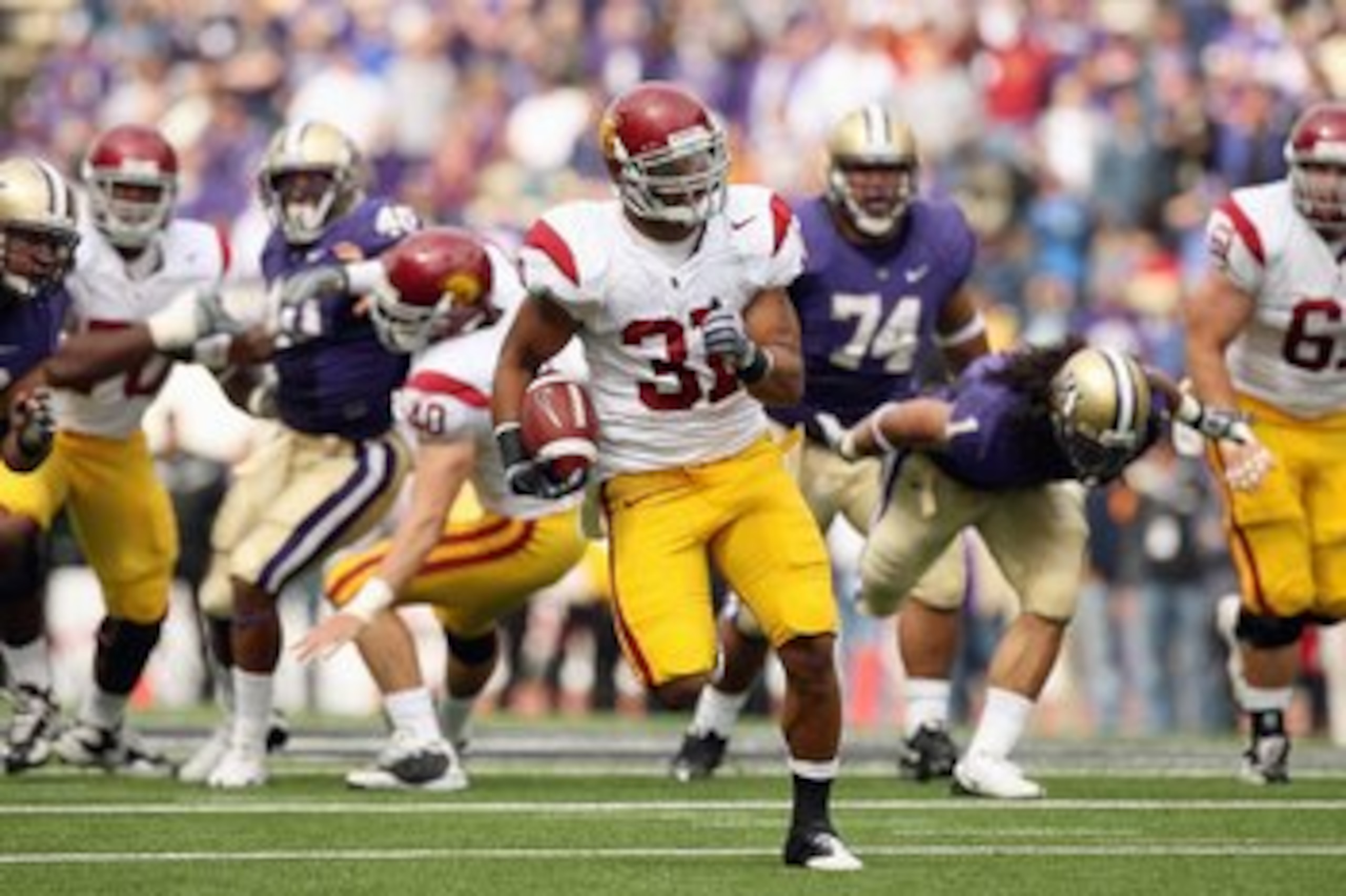 SEATTLE - SEPTEMBER 19:  Stanley Havili #31 of the USC Trojans carries the ball during the game against the Washington Huskies on September 19, 2009 at Husky Stadium in Seattle, Washington. The Huskies defeated the Trojans 16-13. (Photo by Otto Greule Jr/