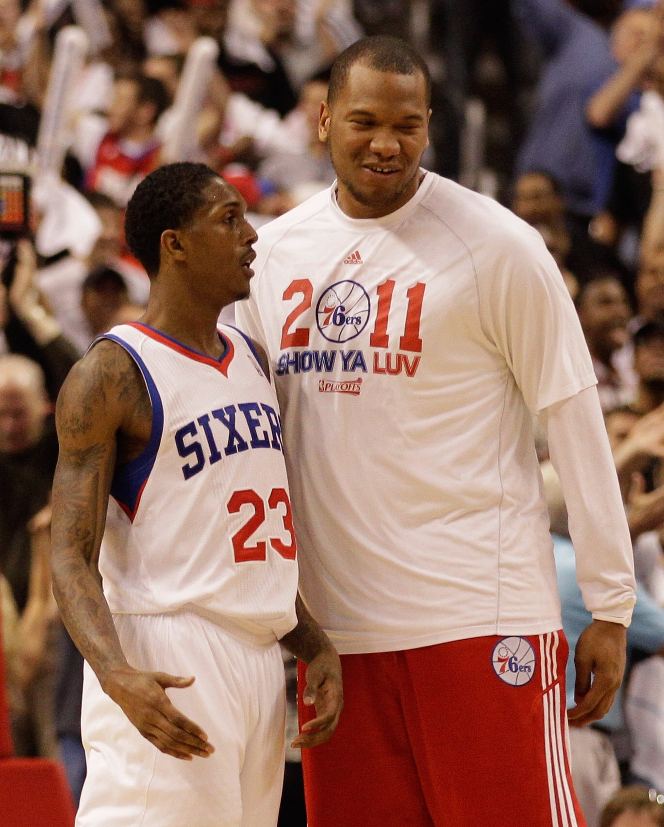 PHILADELPHIA, PA - APRIL 24: Lou Williams #23 is congratulated by teammate Marreese Speights #16 of the Philadelphia 76ers (R) after hitting a basket late in the fourth quarter against the Miami Heat in Game Four of the Eastern Conference Quarterfinals in