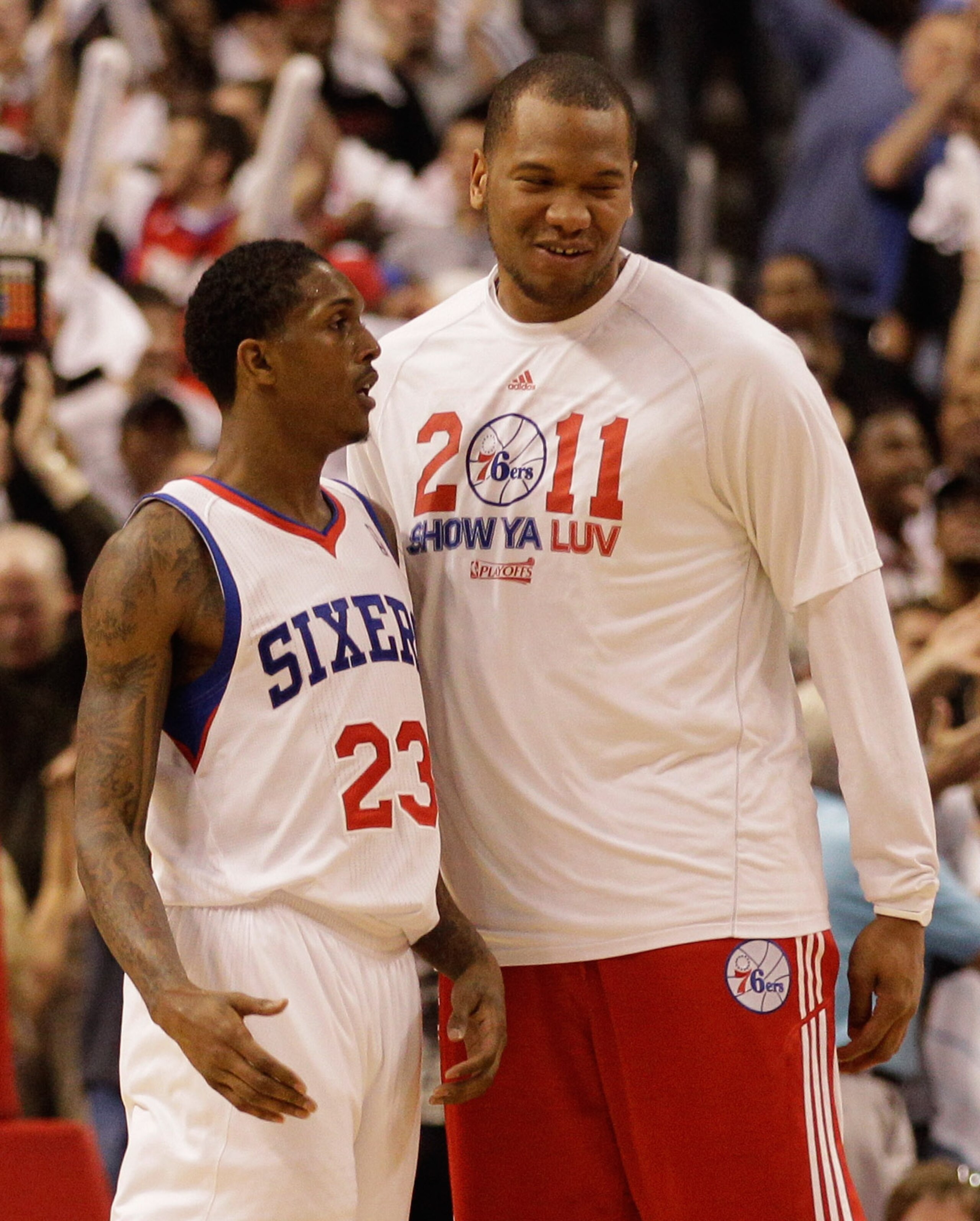 PHILADELPHIA, PA - APRIL 24: Lou Williams #23 is congratulated by teammate Marreese Speights #16 of the Philadelphia 76ers (R) after hitting a basket late in the fourth quarter against the Miami Heat in Game Four of the Eastern Conference Quarterfinals in