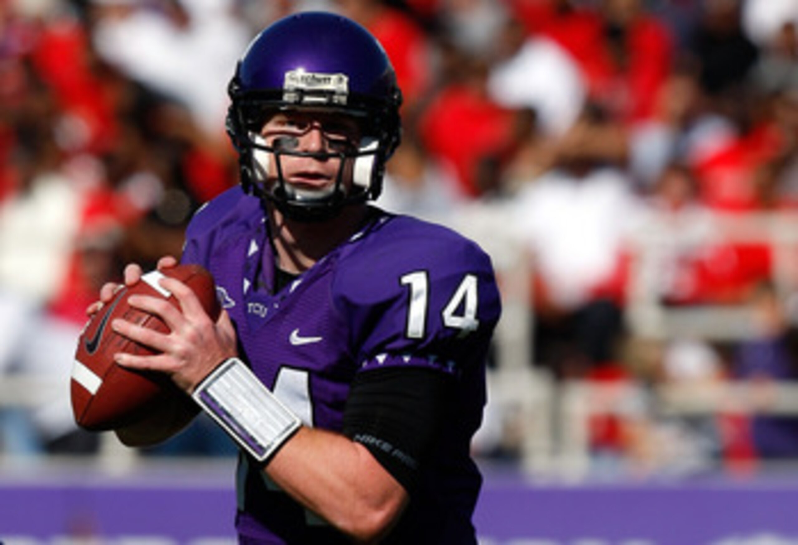 FORT WORTH, TX - NOVEMBER 28:  Quarterback Andy Dalton #14 of the TCU Horned Frogs drops back to pass against the New Mexico Lobos at Amon G. Carter Stadium on November 28, 2009 in Fort Worth, Texas.  (Photo by Ronald Martinez/Getty Images)