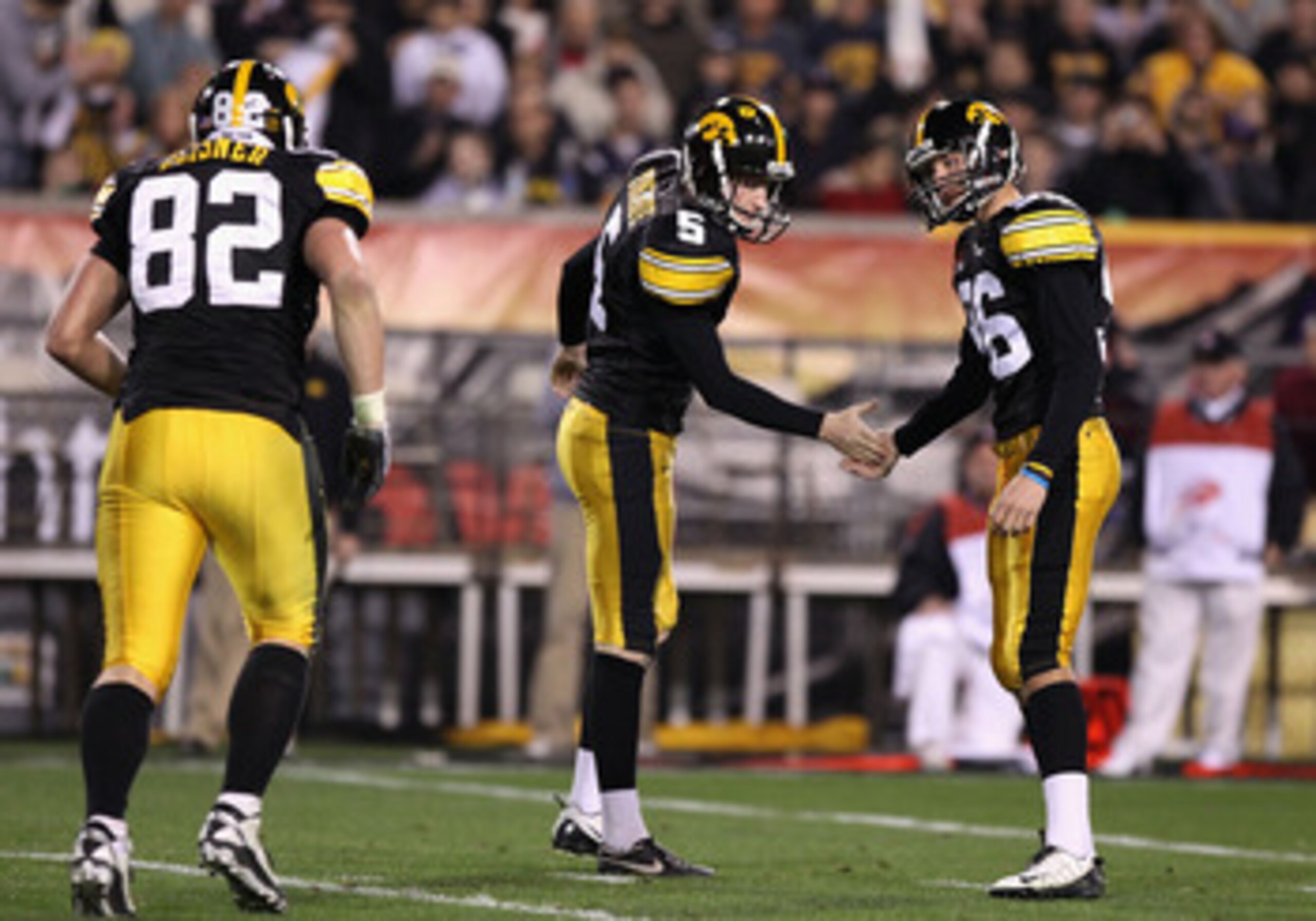 TEMPE, AZ - DECEMBER 28: Kicker Michael Meyer #96 of the Iowa Hawkeyes high fives teammate Ryan Donahue #5 after kicking a 21 yard field goal against the Missouri Tigers during the third quarter of the Insight Bowl at Sun Devil Stadium on December 28, 20 TEMPE, AZ - DECEMBER 28: Kicker Michael Meyer #96 of the Iowa Hawkeyes high fives teammate Ryan Donahue #5 after kicking a 21 yard field goal against the Missouri Tigers during the third quarter of the Insight Bowl at Sun Devil Stadium on December 28, 20
