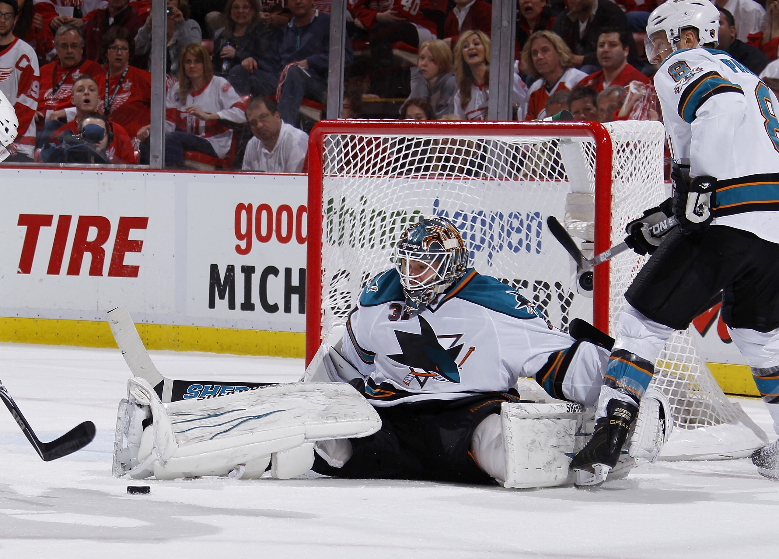 DETROIT - MAY 10: Antti Niemi #31 of the San Jose Sharks watches the rebound in the second period after saving a goal shot by the Detroit Red Wings in Game Six of the Western Conference Semifinals during the 2011 NHL Stanley Cup Playoffs on May 10, 2011 a