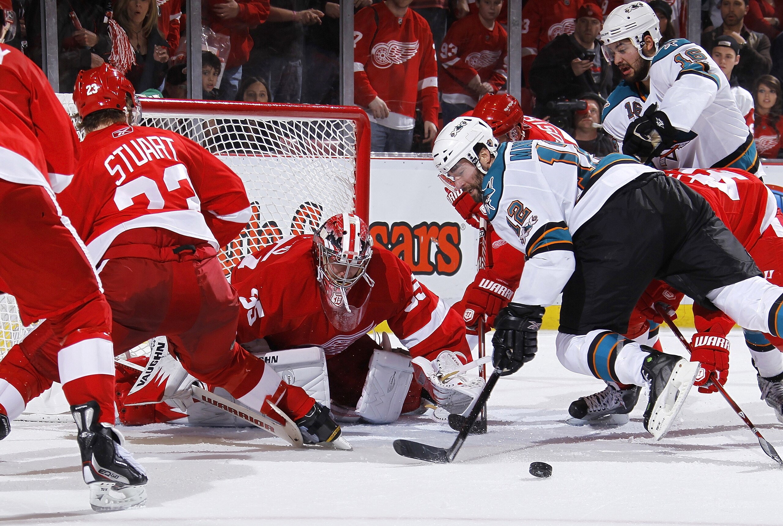 DETROIT - MAY 6: Patrick Marleau #12 of the San Jose Sharks can't get a shot off in front of Jimmy Howard #35 of the Detroit Red Wings during the third period in Game Four of the Western Conference Semifinals during the 2011 NHL Stanley Cup Playoffs on Ma