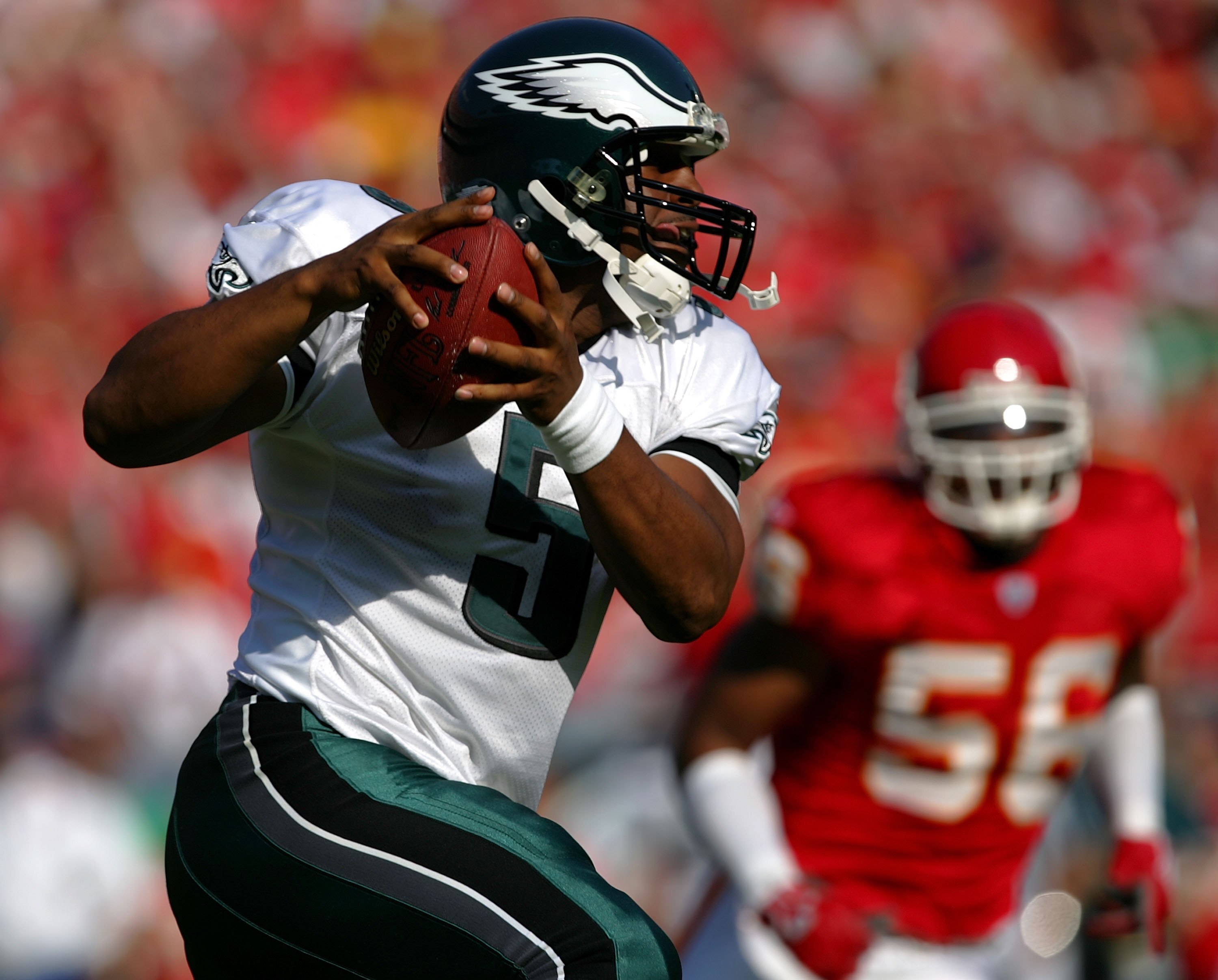 KANSAS CITY, MO - OCTOBER 02:  Quarterback Donovan McNabb #5 of the Philadelphia Eagles is chased by Derrick Johnson #56 of the Kansas City Chiefs during the first half of the game on October 2, 2005 at Arrowhead Stadium in Kansas City, Missouri.  (Photo