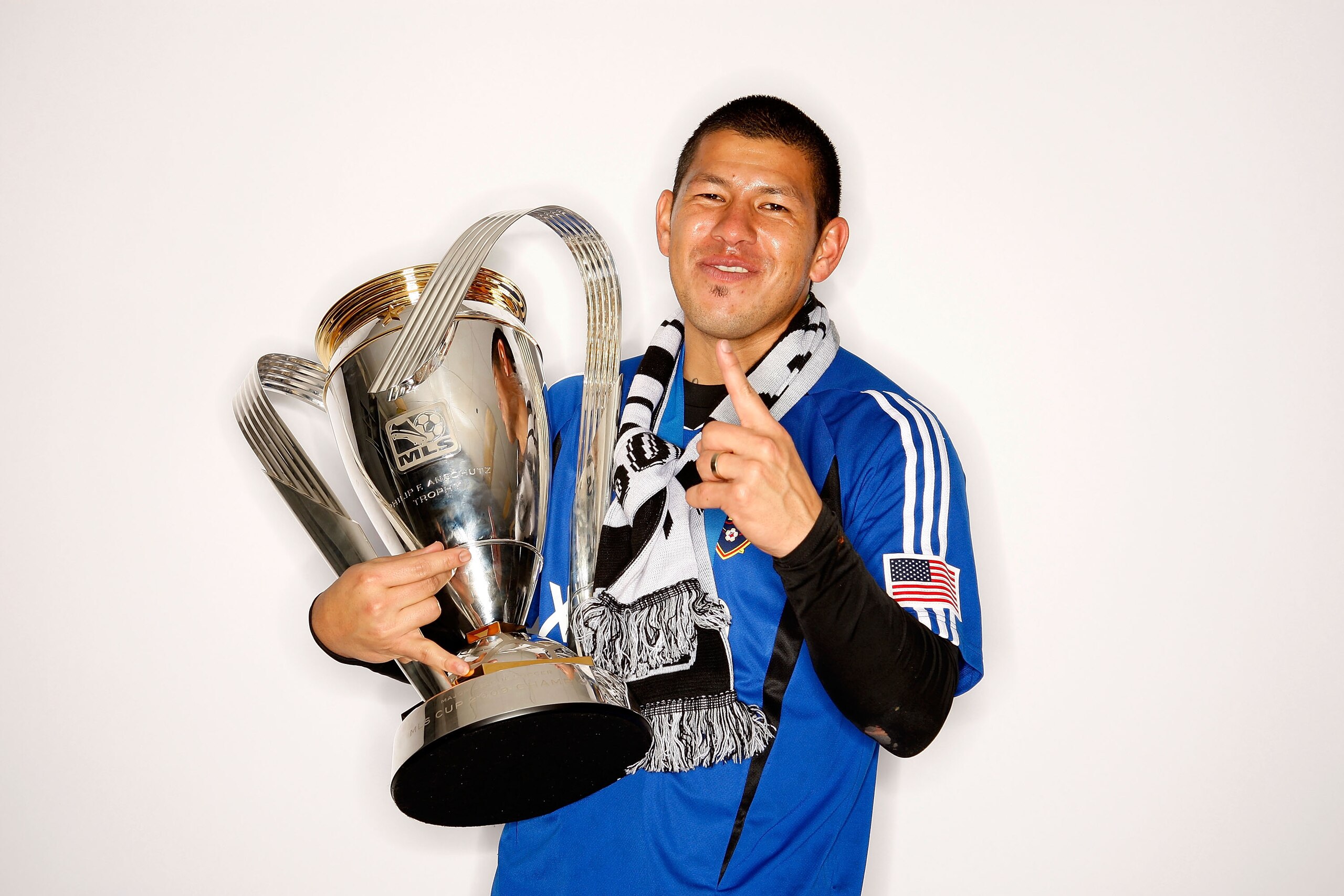 SEATTLE - NOVEMBER 22:  Nick Rimando #18 of Real Salt Lake poses with the Philip F. Anschutz MLS Cup trophy following their win in the MLS Cup final at Qwest Field on November 22, 2009 in Seattle, Washington.  (Photo by Harry How/Getty Images for MLS)