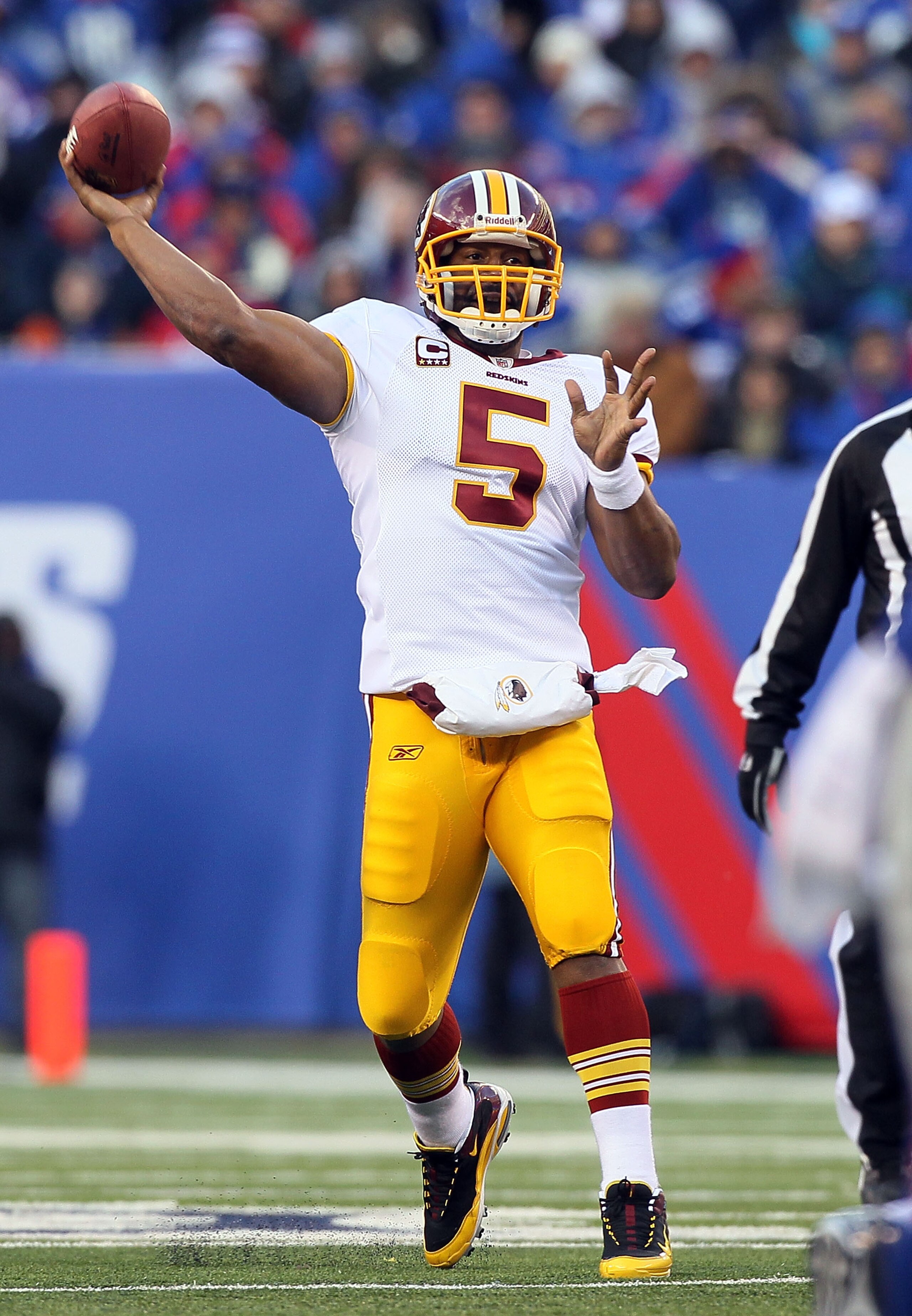 EAST RUTHERFORD, NJ - DECEMBER 05: Donovan McNabb #5 of the Washington Redskins throws a pass against the New York Giants on December 5, 2010 at the New Meadowlands Stadium in East Rutherford, New Jersey. The Giants defeated the Redskins 31-7.  (Photo by