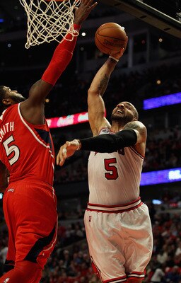 CHICAGO, IL - MAY 04: Carlos Boozer #5 of the Chicago Bulls tries to shoot against Josh Smith #5 of the Atlanta Hawks in Game Two of the Eastern Conference Semifinals in the 2011 NBA Playoffs at the United Center on May 4, 2011 in Chicago, Illinois. The B