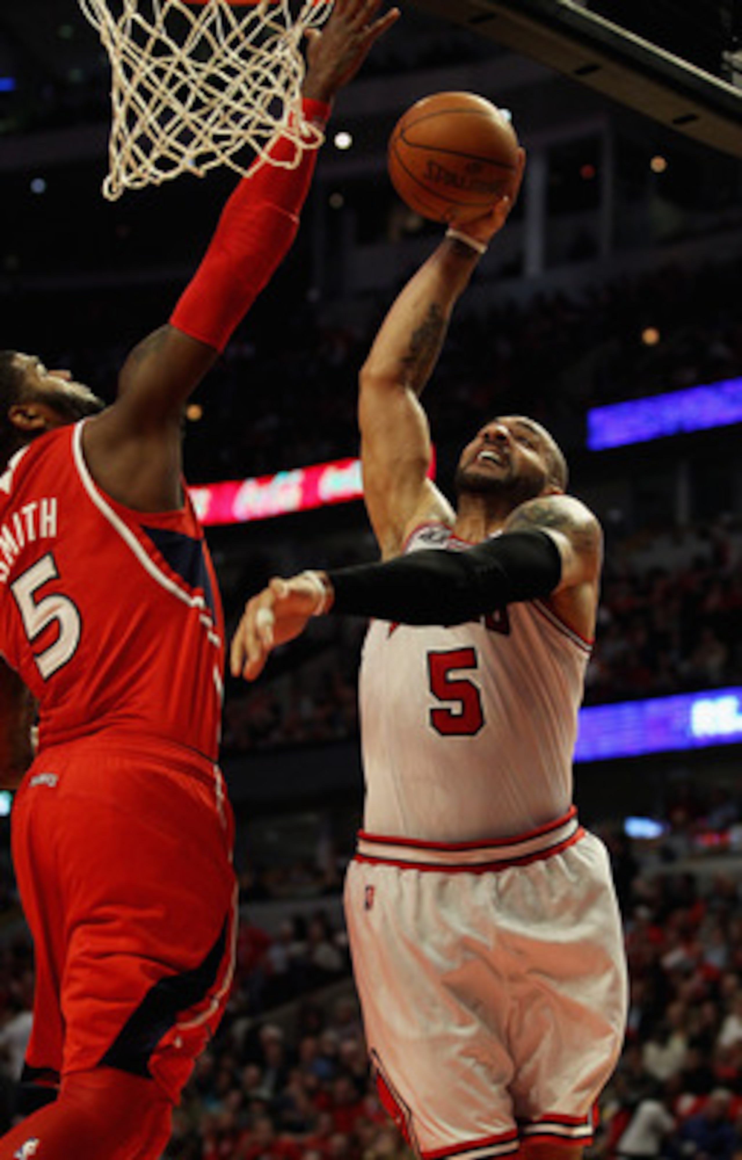 CHICAGO, IL - MAY 04: Carlos Boozer #5 of the Chicago Bulls tries to shoot against Josh Smith #5 of the Atlanta Hawks in Game Two of the Eastern Conference Semifinals in the 2011 NBA Playoffs at the United Center on May 4, 2011 in Chicago, Illinois. The B