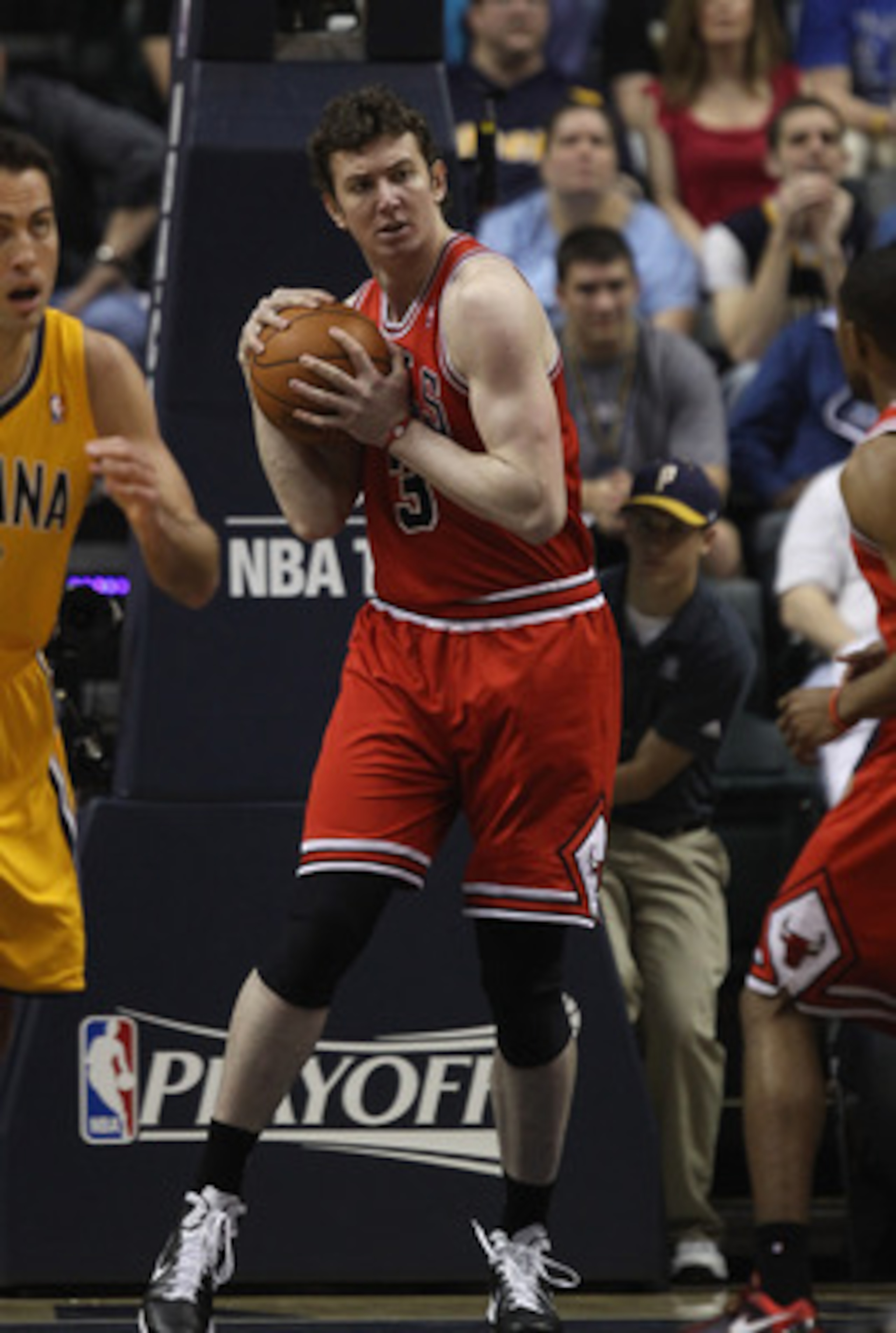 INDIANAPOLIS, IN - APRIL 23: Omer Asik #3 of the Chicago Bulls grabs a rebound against the Indiana Pacers in Game Four of the Eastern Conference Quarterfinals in the 2011 NBA Playoffs at Conseco Fieldhouse on April 23, 2011 in Indianapolis, Indiana. The P