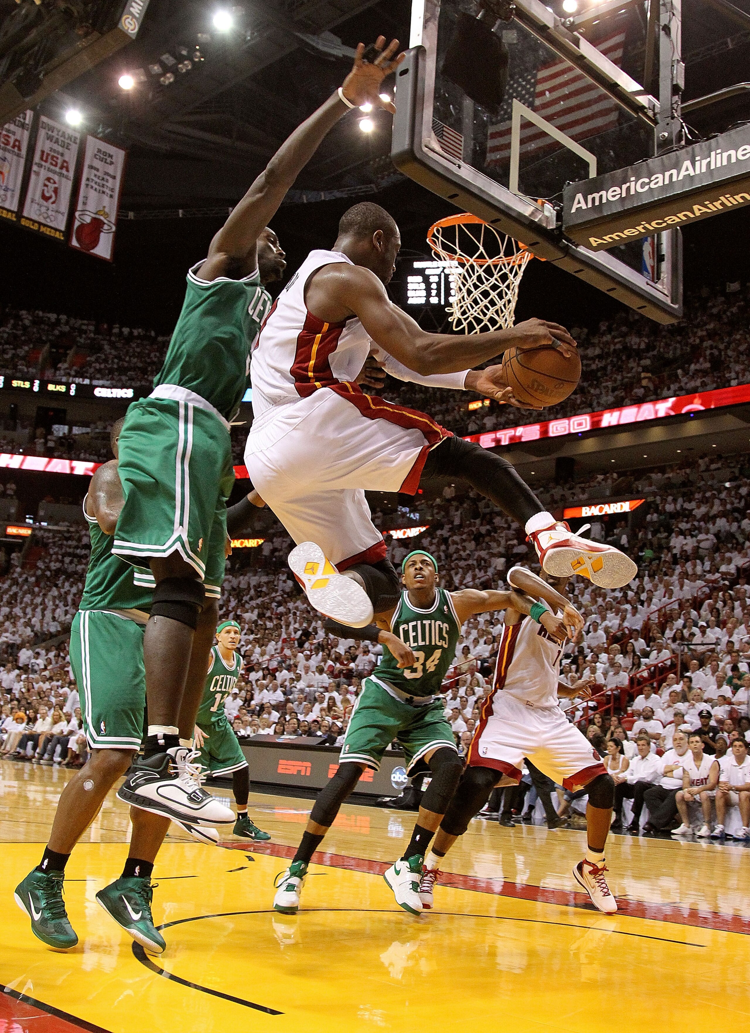 MIAMI, FL - MAY 01:  Dwyane Wade #3 of the Miami Heat Passes around Kevin Garnett #5 of the Boston Celtics during Game One of the Eastern Conference Semifinals of the 2011 NBA Playoffs at American Airlines Arena on May 1, 2011 in Miami, Florida. NOTE TO U