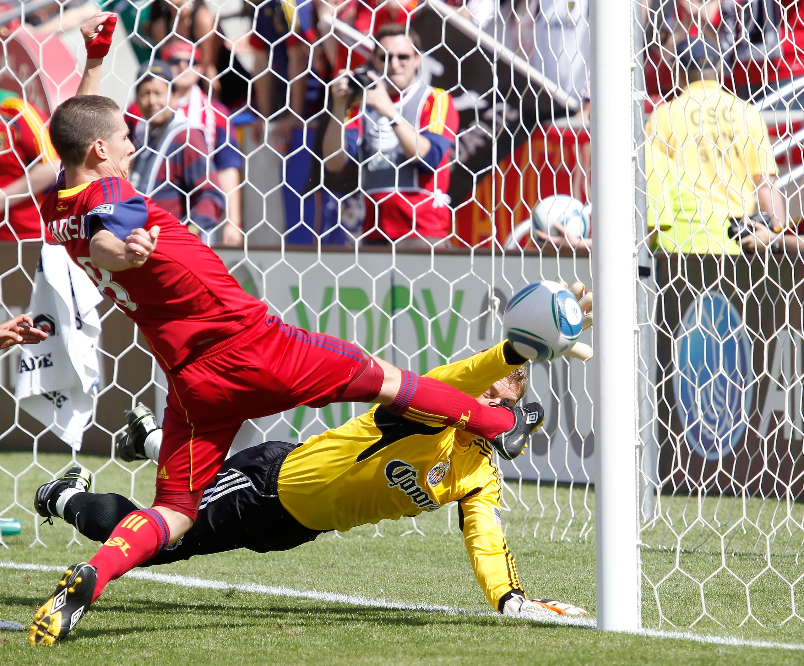 SANDY, UT - MAY 7:  Will Johnson #8 of Real Salt Lake scores the game winning goal on goalie Dan Kennedy #1 of Chivas USA during the second half of an MLS soccer game May 7, 2011 at Rio Tinto Stadium in Sandy, Utah. Real Salt Lake beat Chivas USA 1-0. (Ph