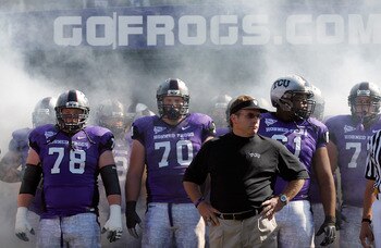 FORT WORTH, TX - OCTOBER 16:  Head coach Gary Patterson of the TCU Horned Frogs takes to the field with offensive guard Josh Vernon #78 and tackle Zach Roth #70 against the BYU Cougars at Amon G. Carter Stadium on October 16, 2010 in Fort Worth, Texas.  (