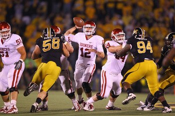 COLUMBIA, MO - OCTOBER 23: Landry Jones #12 of the Oklahoma Sooners in action against the Missouri Tigers at Faurot Field/Memorial Stadium on October 23, 2010 in Columbia, Missouri.  The Tigers beat the Sooners 36-27.  (Photo by Dilip Vishwanat/Getty Imag