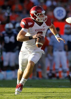 AUBURN, AL - OCTOBER 16:  Quarterback Tyler Wilson #8 of the Arkansas Razorbacks rolls out and looks downfield for a receiver during the game against the Auburn Tigers at Jordan-Hare Stadium on October 16, 2010 in Auburn, Alabama.  The Tigers beat the Raz
