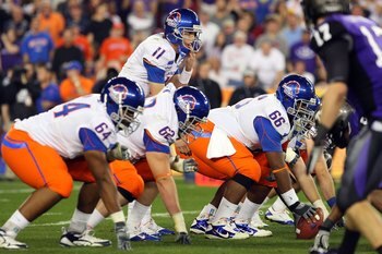 GLENDALE, AZ - JANUARY 04:  Quarterback Kellen Moore #11 of the Boise State Broncos under center against the TCU Horned Frogs during the Tostitos Fiesta Bowl at the Universtity of Phoenix Stadium on January 4, 2010 in Glendale, Arizona.  (Photo by Christi