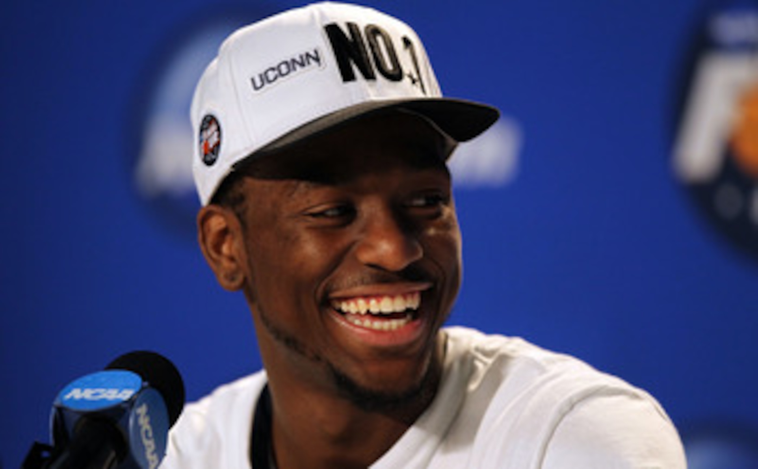 HOUSTON, TX - APRIL 04:  Kemba Walker #15 of the Connecticut Huskies speaks to the media after defeating the Butler Bulldogs to win the National Championship Game of the 2011 NCAA Division I Men's Basketball Tournament at Reliant Stadium on April 4, 2011