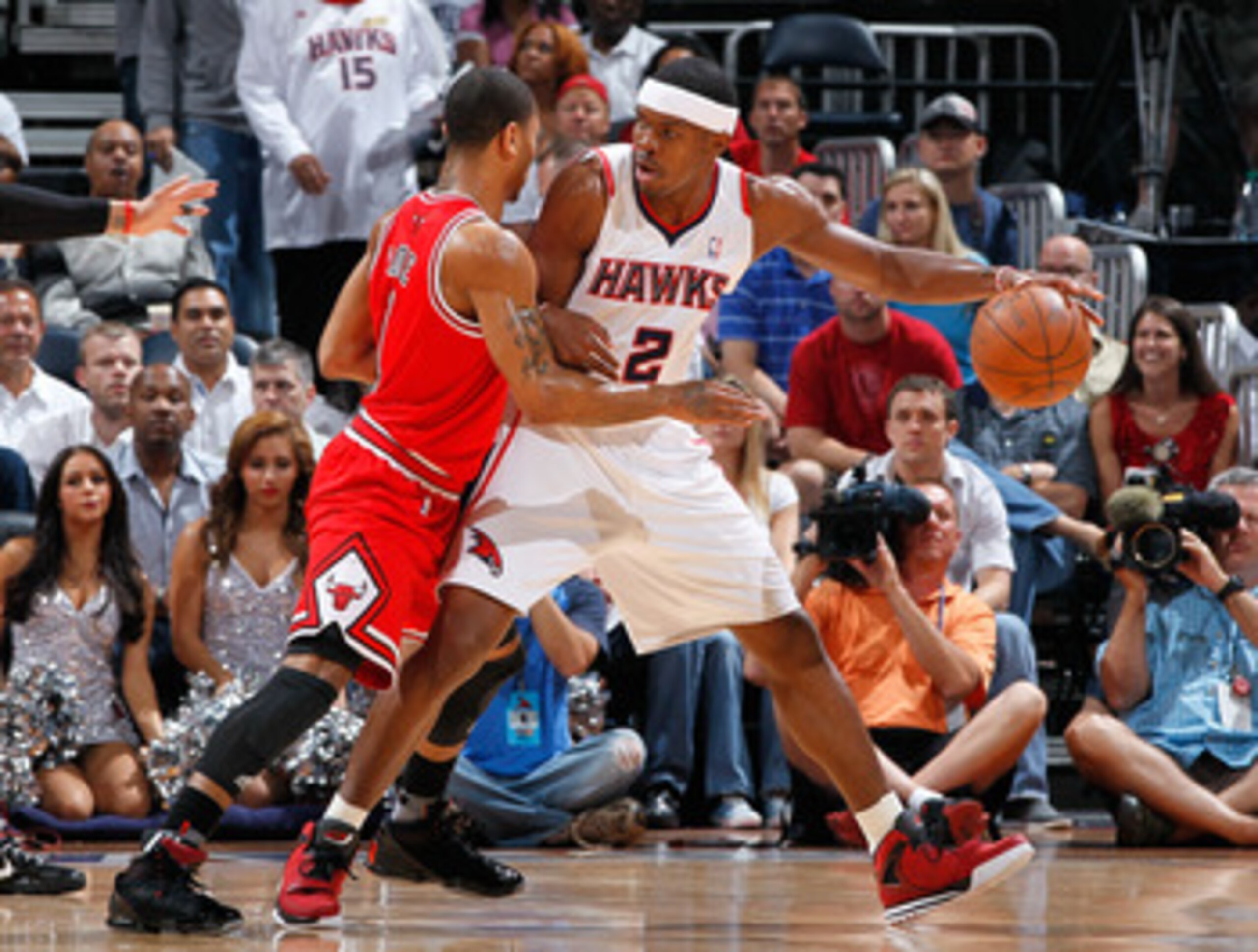 ATLANTA, GA - MAY 08:  Joe Johnson #2 of the Atlanta Hawks drives against Derrick Rose #1 of the Chicago Bulls in Game Four of the Eastern Conference Semifinals in the 2011 NBA Playoffs at Phillips Arena on May 8, 2011 in Atlanta, Georgia.  NOTE TO USER: