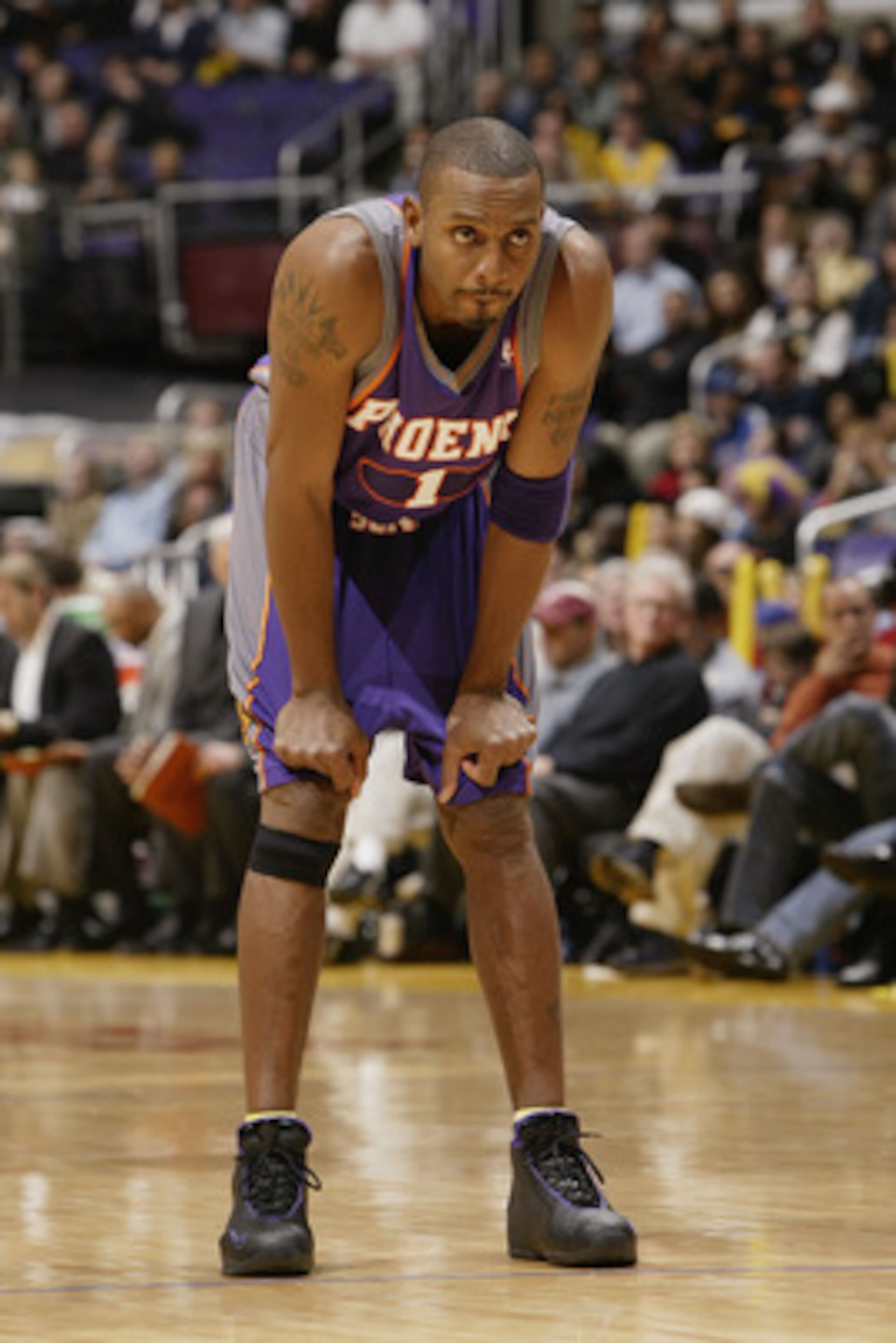 LOS ANGELES - DECEMBER 21:  Anfernee Hardaway #1 of the Phoenix Suns rests during the game against the Los Angeles Lakers at Staples Center on December 21, 2003 in Los Angeles, California.  The Lakers won 107-101.  (Photo by Stephen Dunn/Getty Images)