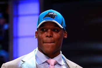 NEW YORK, NY - APRIL 28:  Cam Newton, #1 overall pick by the Carolina Panthers holds up a jersey on stage after he was picked during the 2011 NFL Draft at Radio City Music Hall on April 28, 2011 in New York City.  (Photo by Chris Trotman/Getty Images)