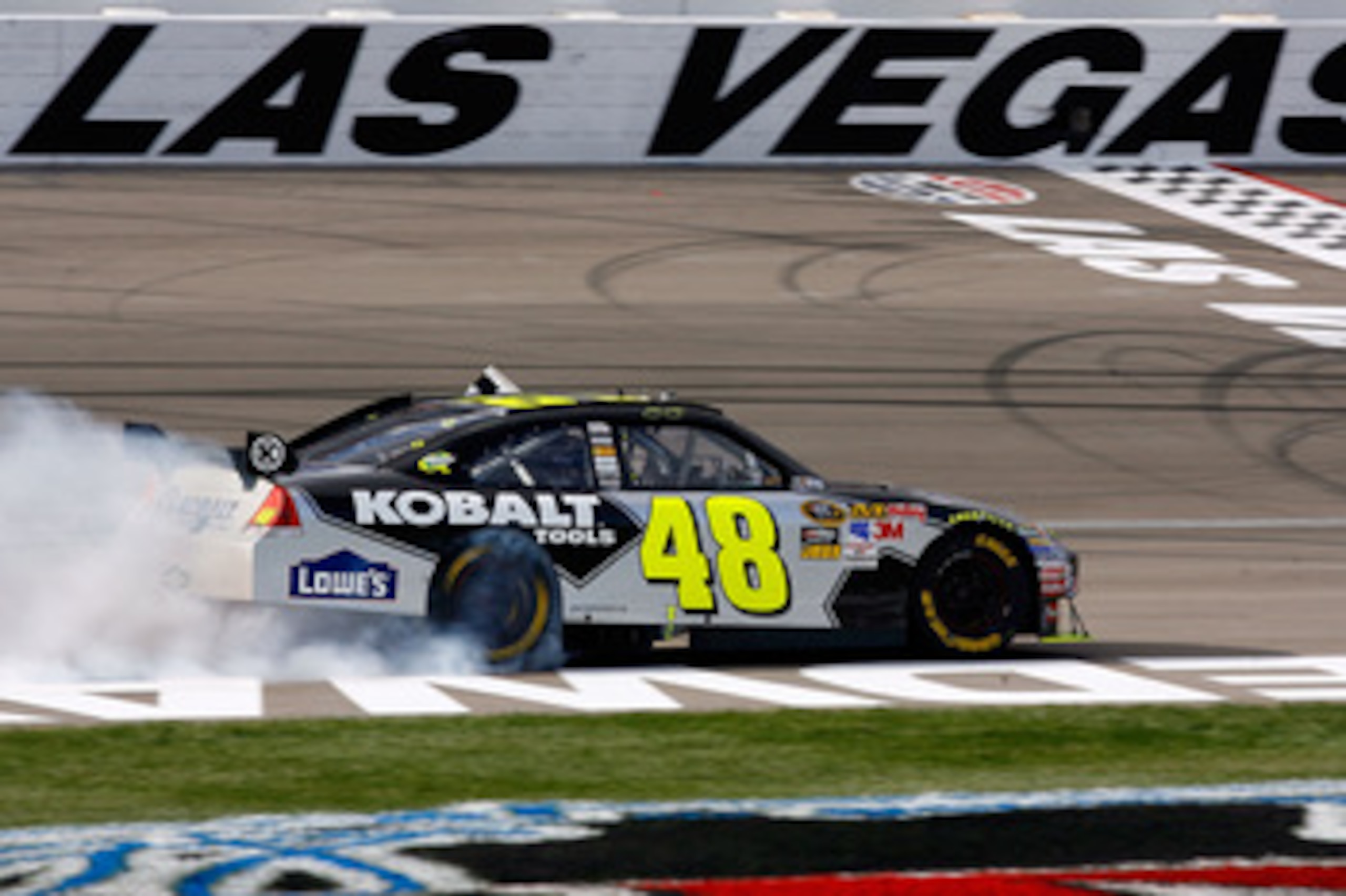 LAS VEGAS - FEBRUARY 28:  Jimmie Johnson, driver of the #48 Lowe's/Kobalt Tools Chevrolet, celebrates by doing a burnout after winning the NASCAR Sprint Cup Series Shelby American at Las Vegas Motor Speedway on February 28, 2010 in Las Vegas, Nevada.  (Ph