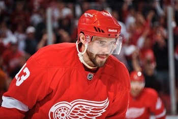 DETROIT - MAY 4: Pavel Datsyuk #13 of the Detroit Red Wings skates against the San Jose Sharks in Game Three of the Western Conference Semifinals during the 2011 NHL Stanley Cup Playoffs on May 4, 2011 at Joe Louis Arena in Detroit, Michigan. (Photo by Ja