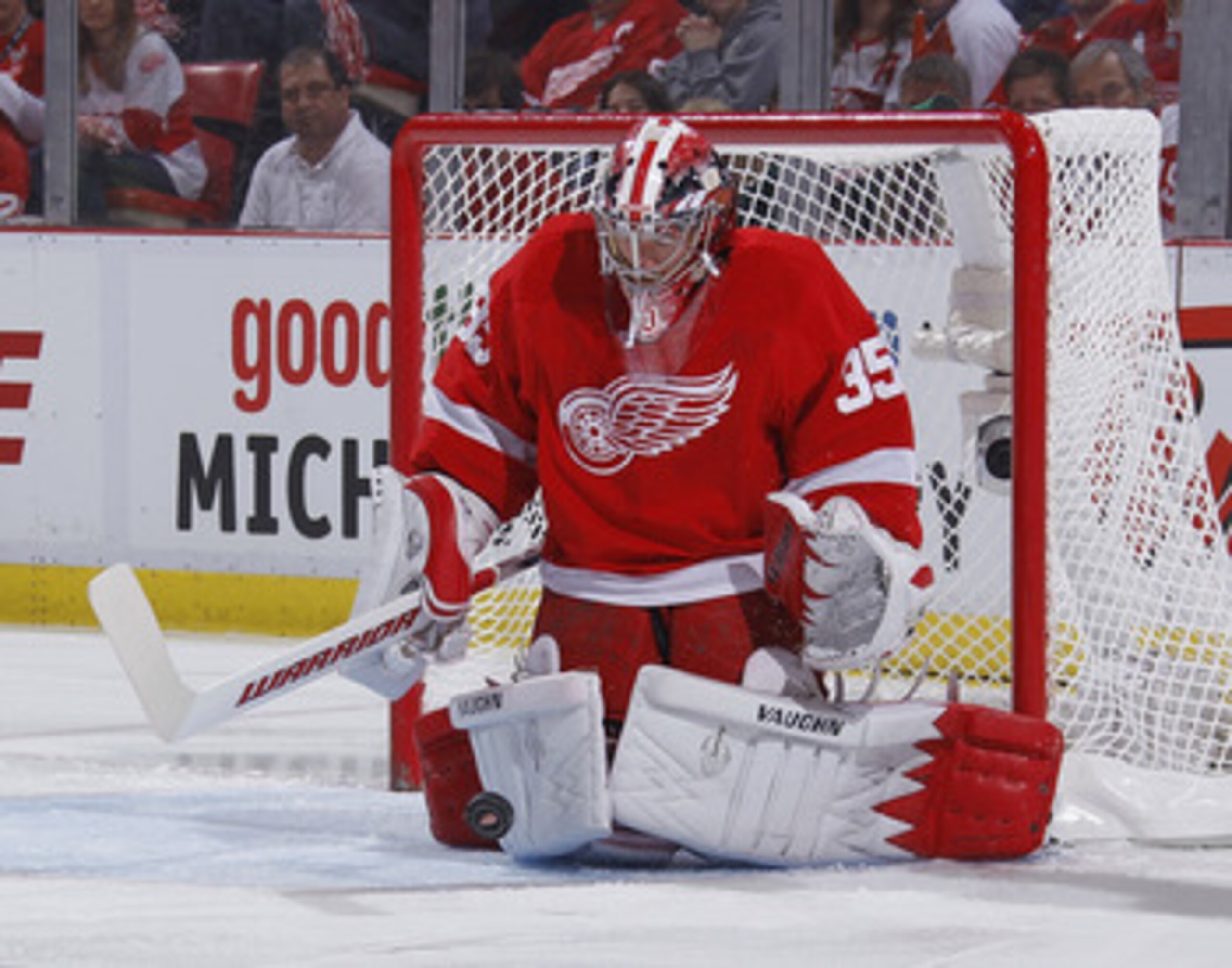 DETROIT - MAY 10: Jimmy Howard #35 of the Detroit Red Wings stops a first period shot by the San Jose Sharks of Game Six of the Western Conference Semifinals during the 2011 NHL Stanley Cup Playoffs on May 10, 2011 at Joe Louis Arena in Detroit, Michigan.