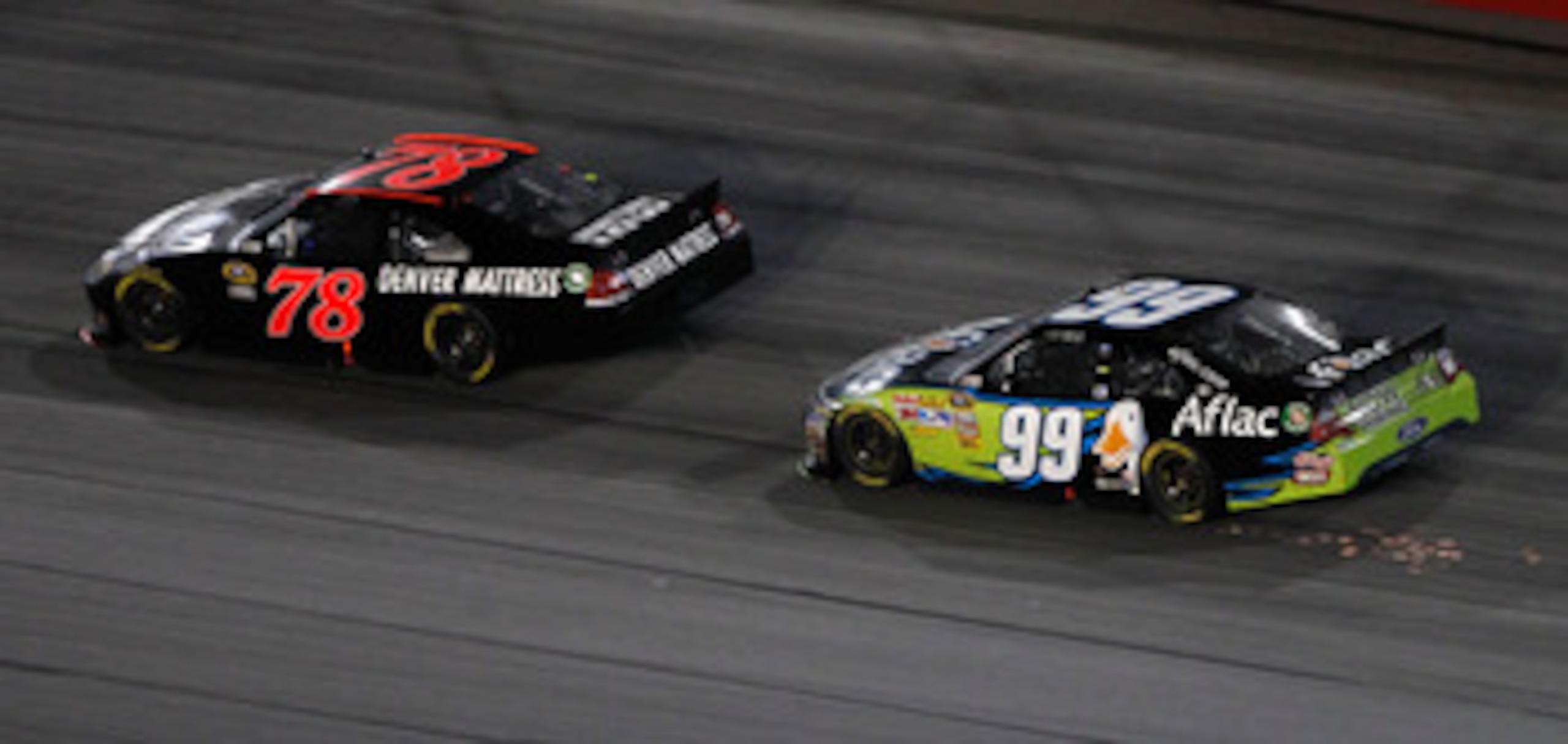 DARLINGTON, SC - MAY 07: Regan Smith, driver of the #78 Furniture Row Companies Chevrolet, leads Carl Edwards, driver of the #99 Aflac Ford, in the final lap of the NASCAR Sprint Cup Series SHOWTIME Southern 500 at Darlington Raceway on May 7, 2011 in Dar