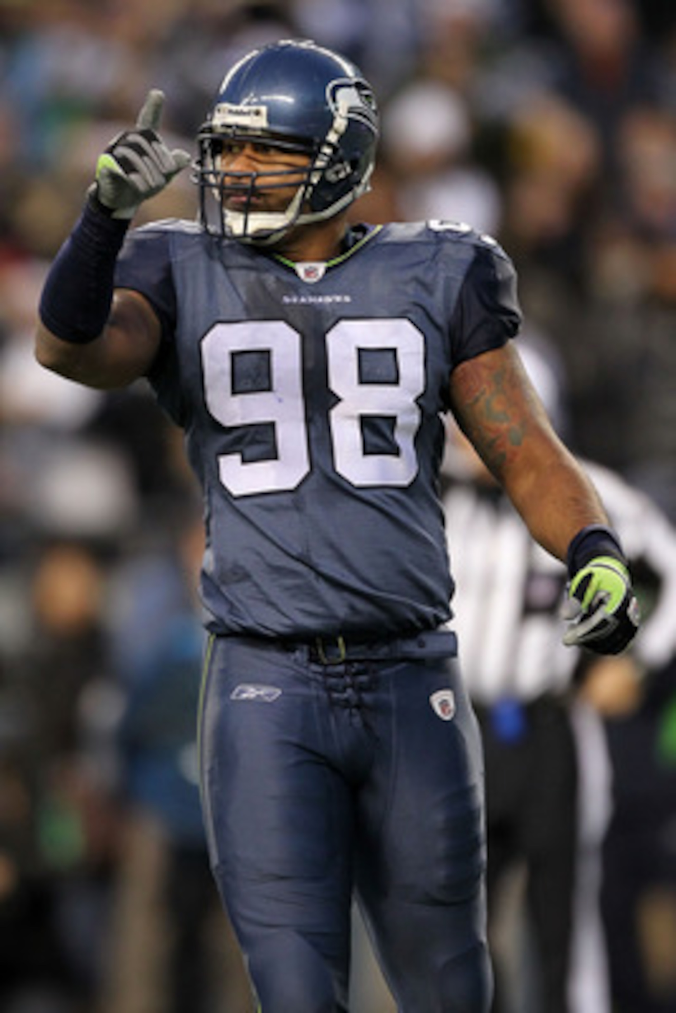 SEATTLE, WA - JANUARY 08:  Raheem Brock #98 of the Seattle Seahawks reacts to a defensice stop in the second half against the New Orleans Saints during the 2011 NFC wild-card playoff game at Qwest Field on January 8, 2011 in Seattle, Washington.  (Photo b